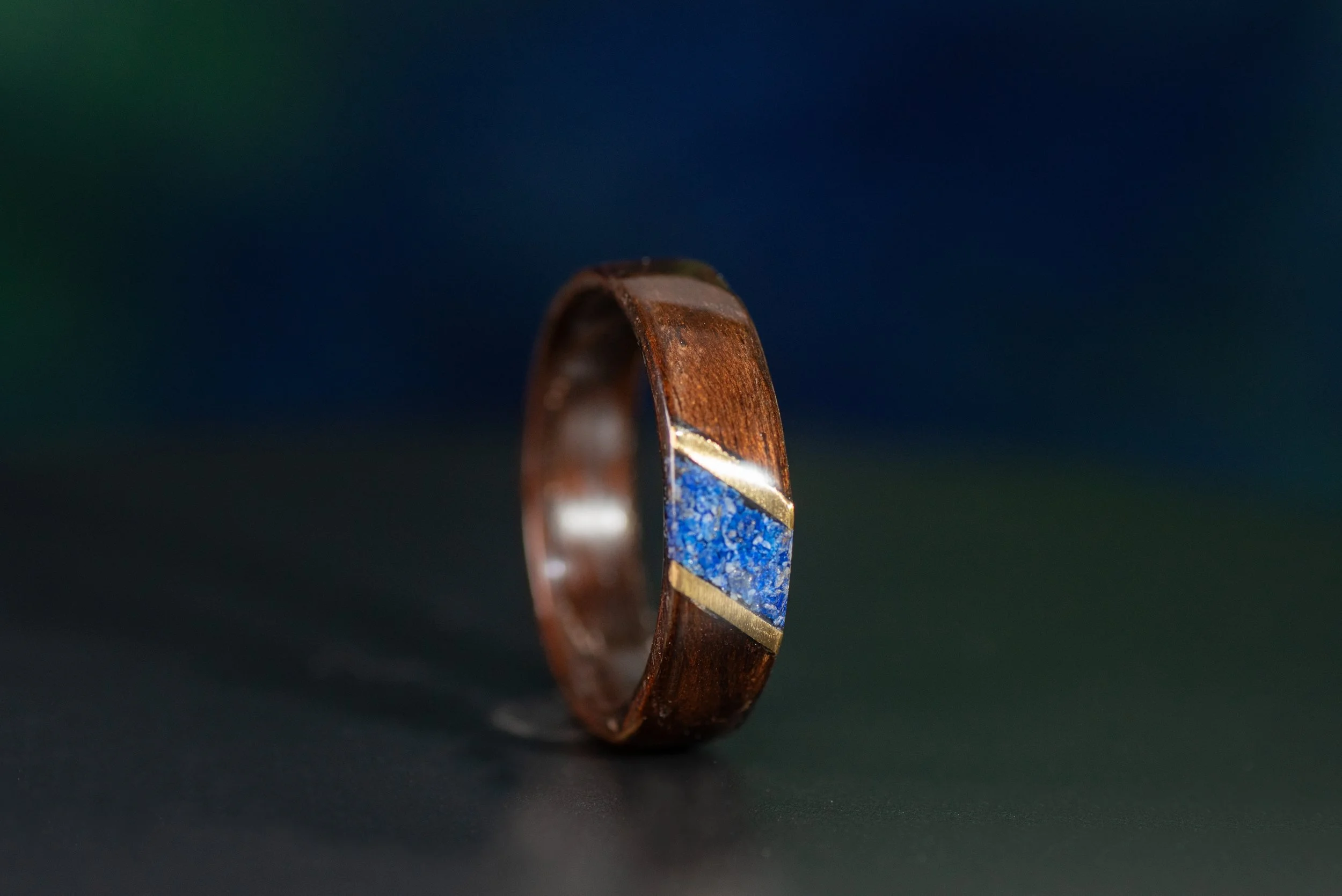 Nature inspired wood ring featuring geometric diamond lapis accent