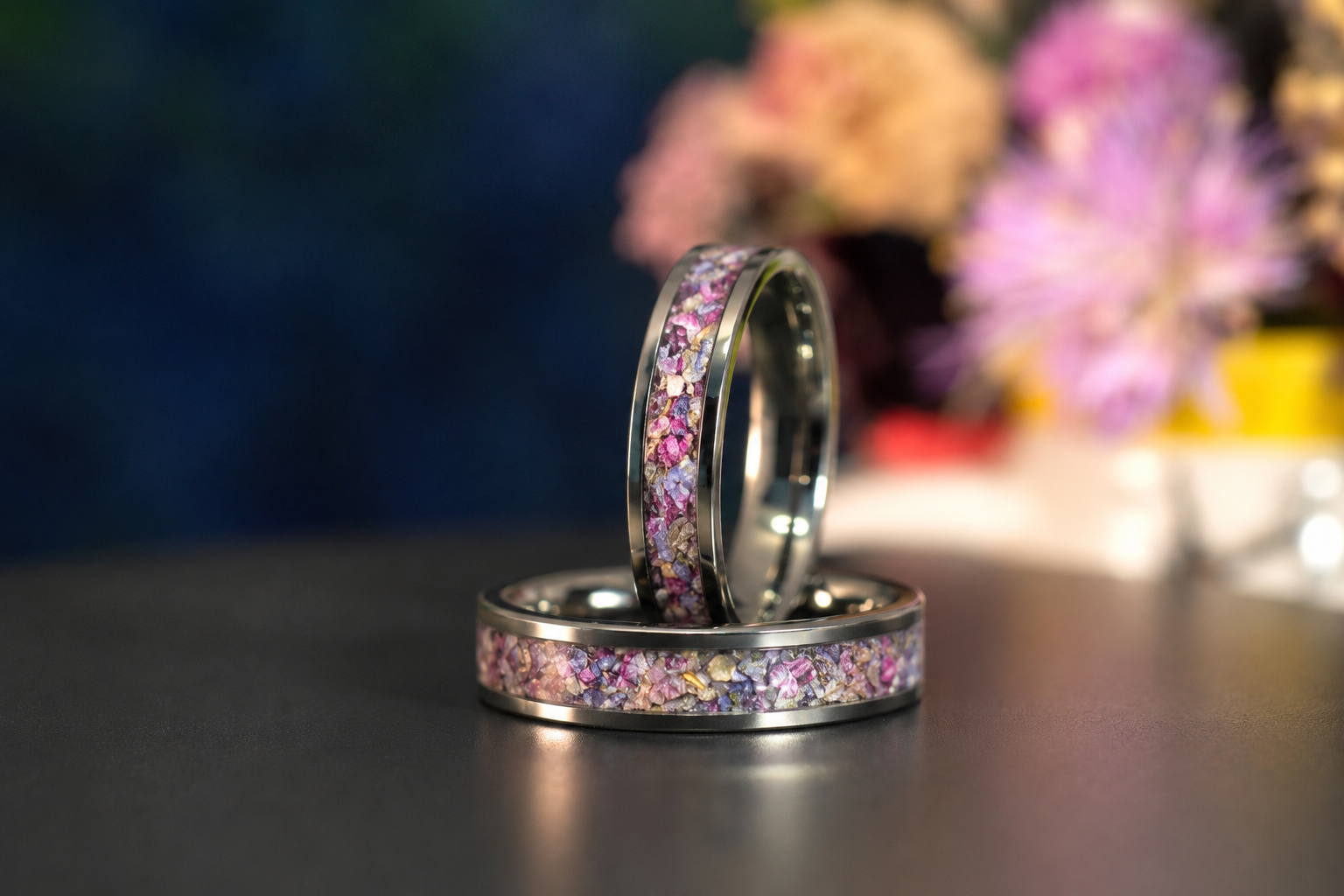 Close-up of dried flower petals preserved inside the inlay of a titanium keepsake ring.
