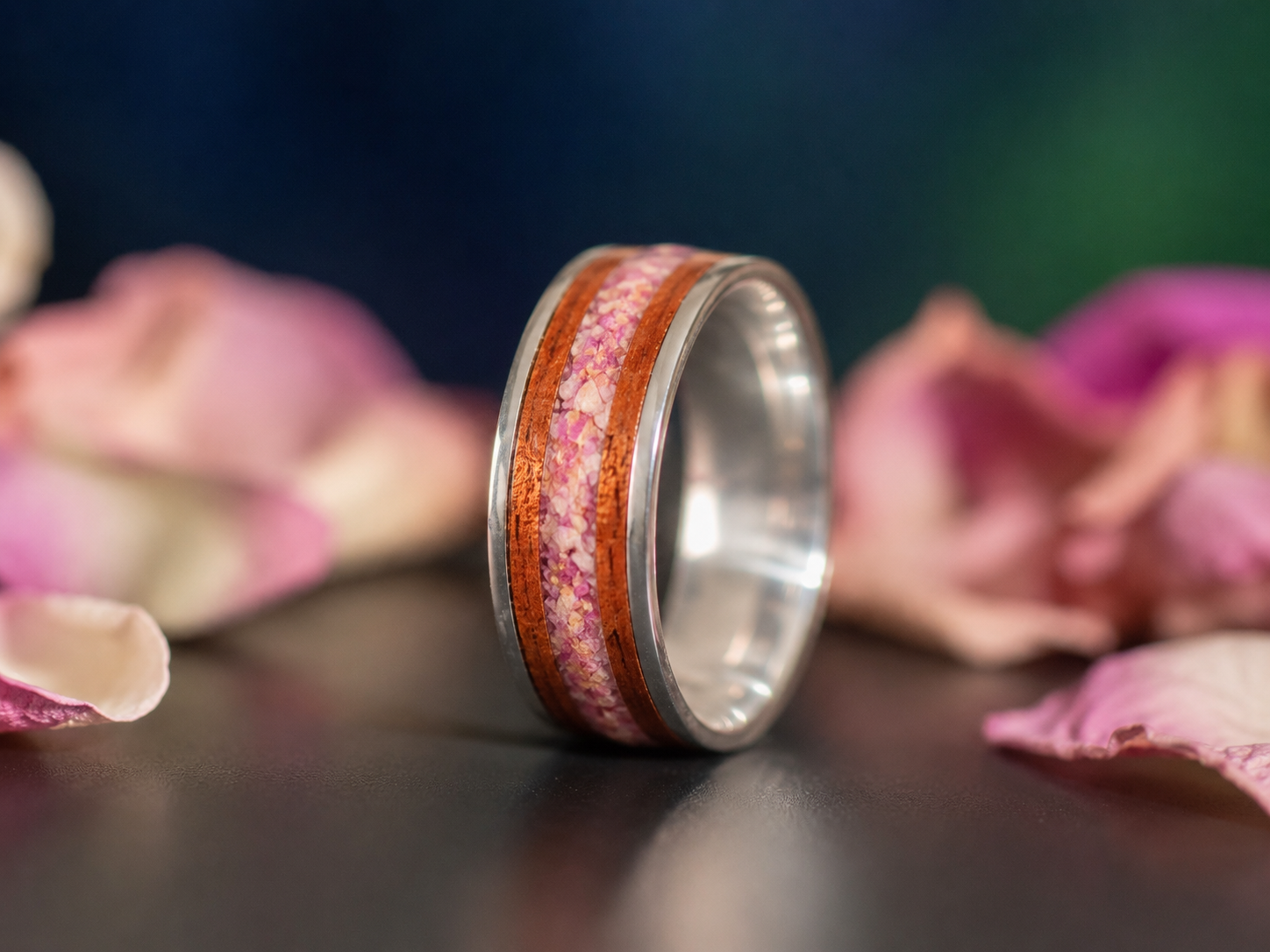 Close-up of preserved wedding or memorial flowers inlaid into a sterling silver and mahogany keepsake ring.