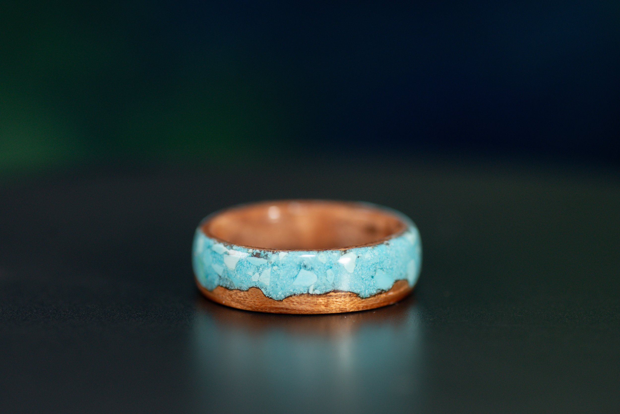 Southwest inspired wood ring featuring a cedar cactus design and bright blue turquoise sky.