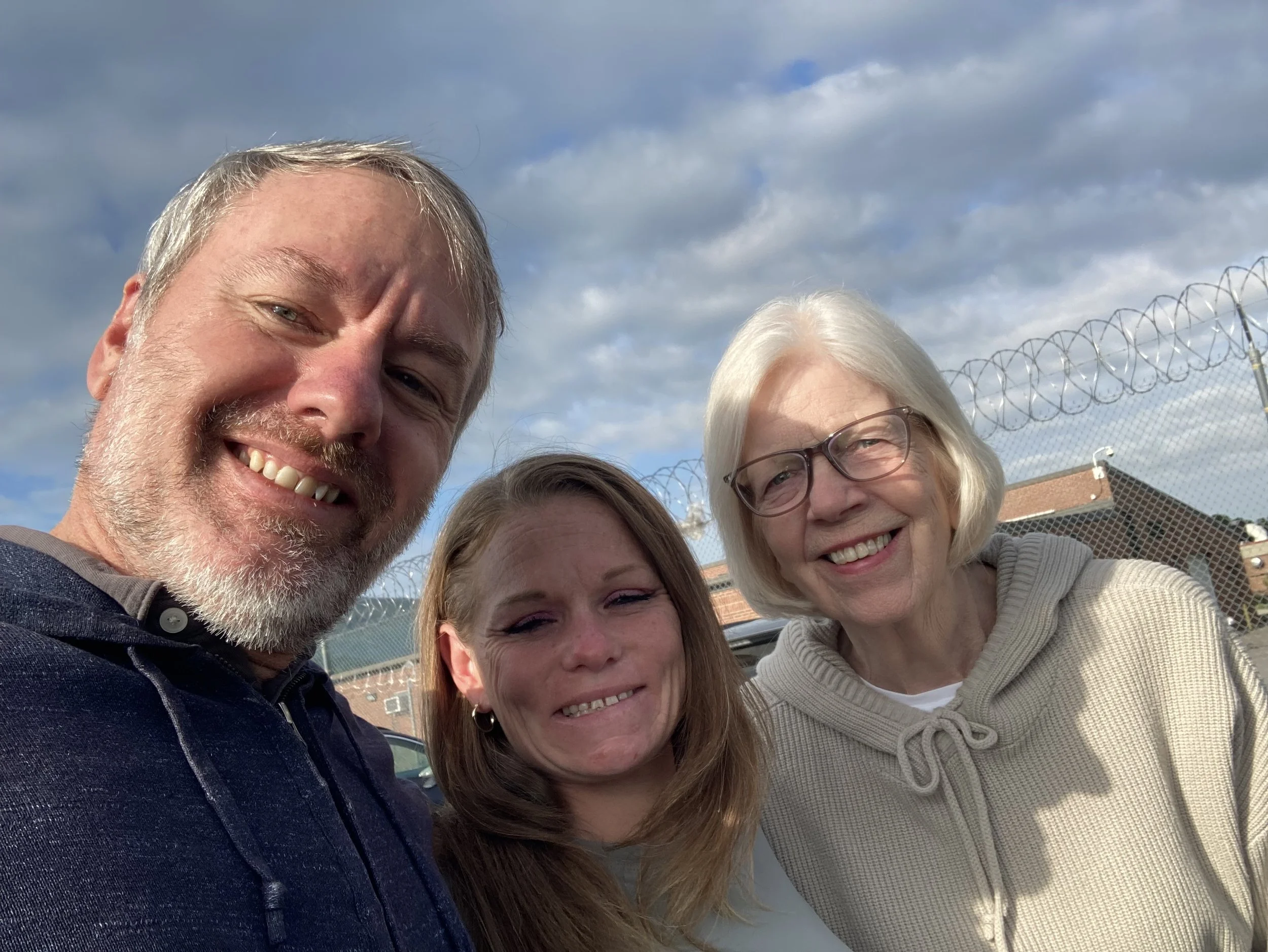Pastor Chad and Jane Derrick welcoming a woman as she leaves incarceration, walking alongside her into her next chapter