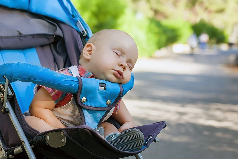 Baby sleeping on a walk with the North Jersey Doulas