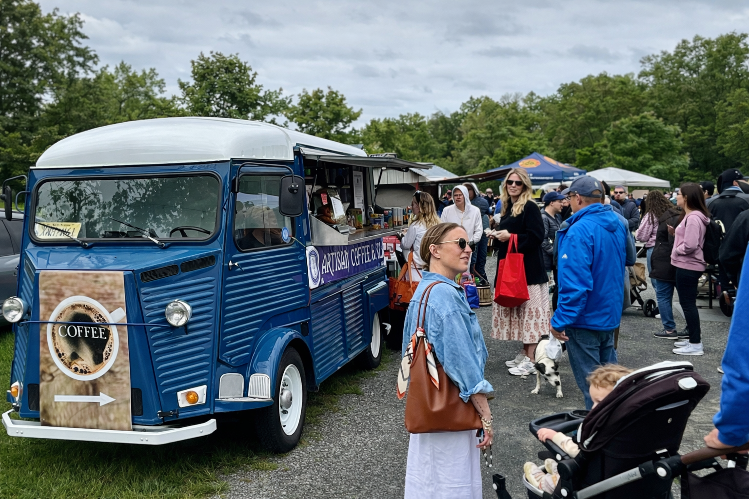 Southside Coffee Co.’s blue coffee truck serving fresh coffee to a crowd at Bedminster Farmer's Market-New Jersey.