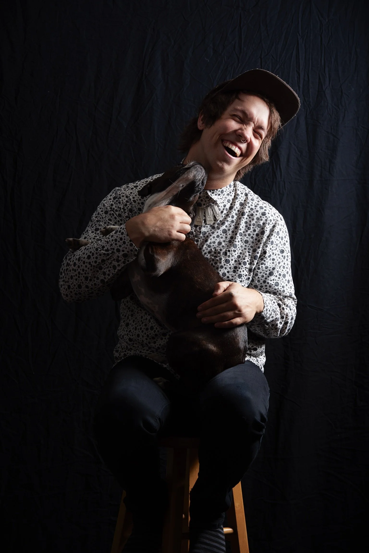Elijah Quinn posing with his dog in Northern British Columbia