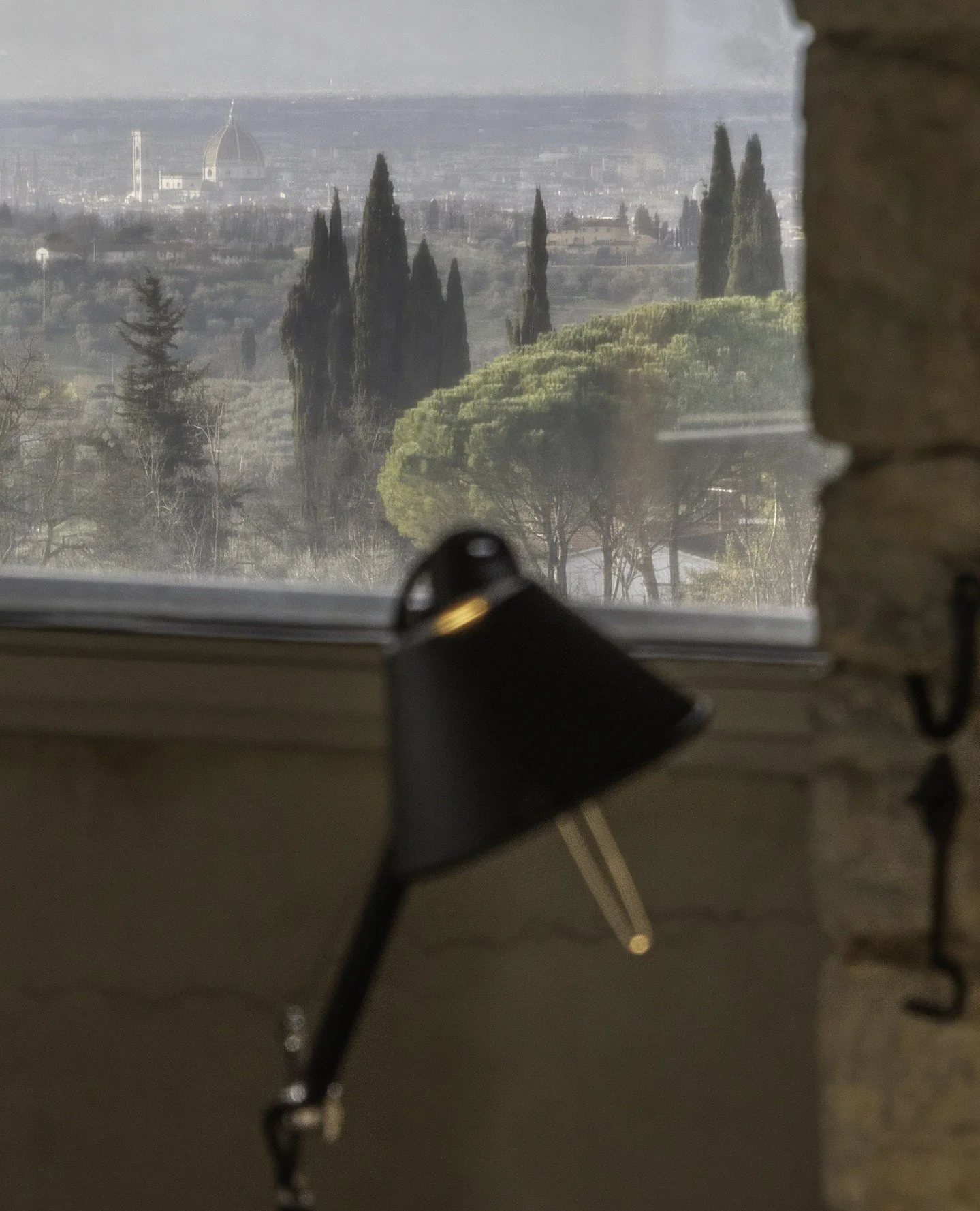 From the Artist Suite, the Tolomeo lamp by Artemide casts its warm light across the room, a perfect companion to the view of Florence&rsquo;s Duomo in the distance.⁠
⁠
A moment of calm, creativity, and comfort, where every detail invites you to slow 