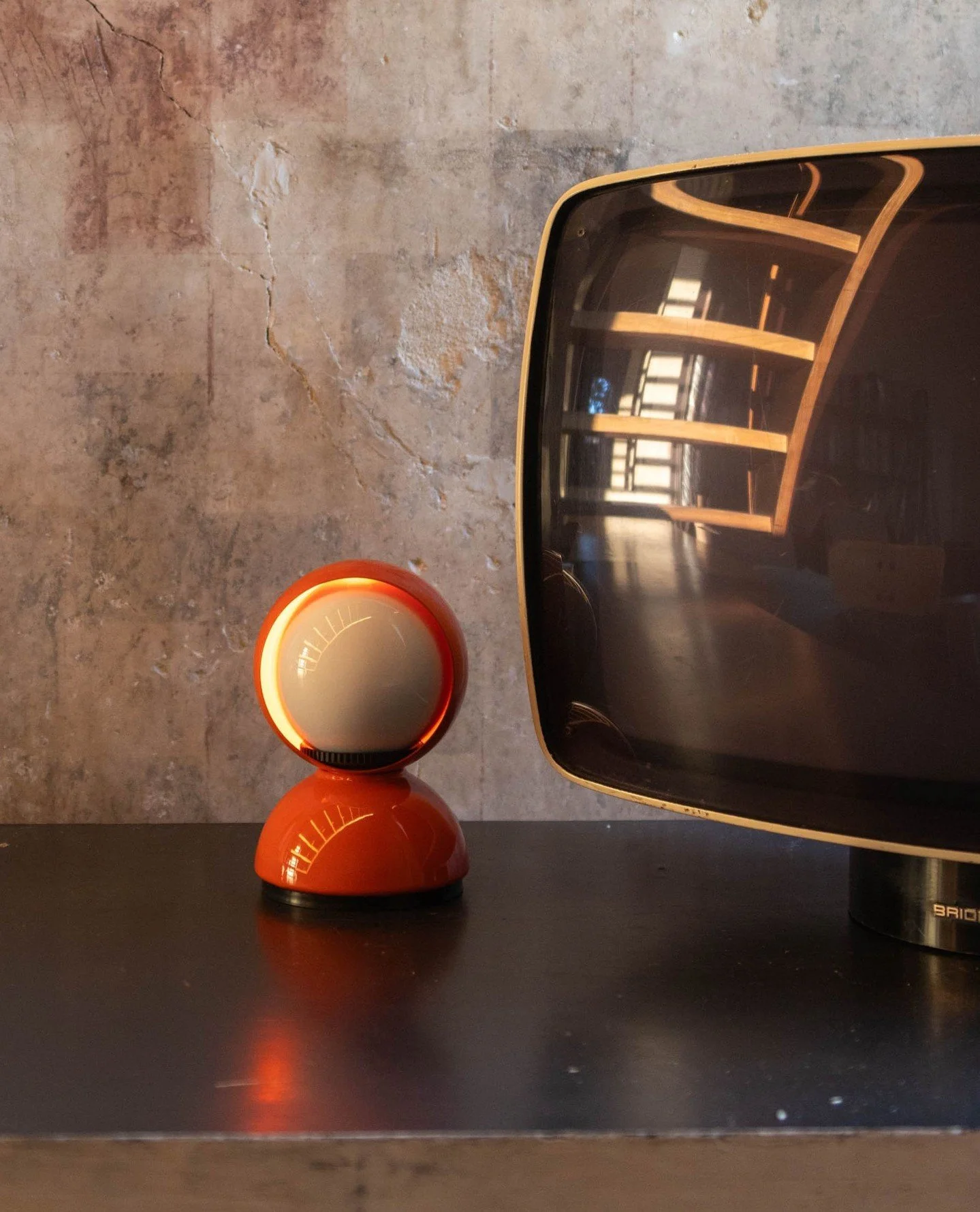 A quiet corner lit by a true design icon.⁠
⁠
In our library room, the Eclisse lamp by Artemide adds a warm, intimate glow, the kind of light that invites you to slow down, open a book, and let time stretch.⁠
⁠
Whether you&rsquo;re writing, reading, o