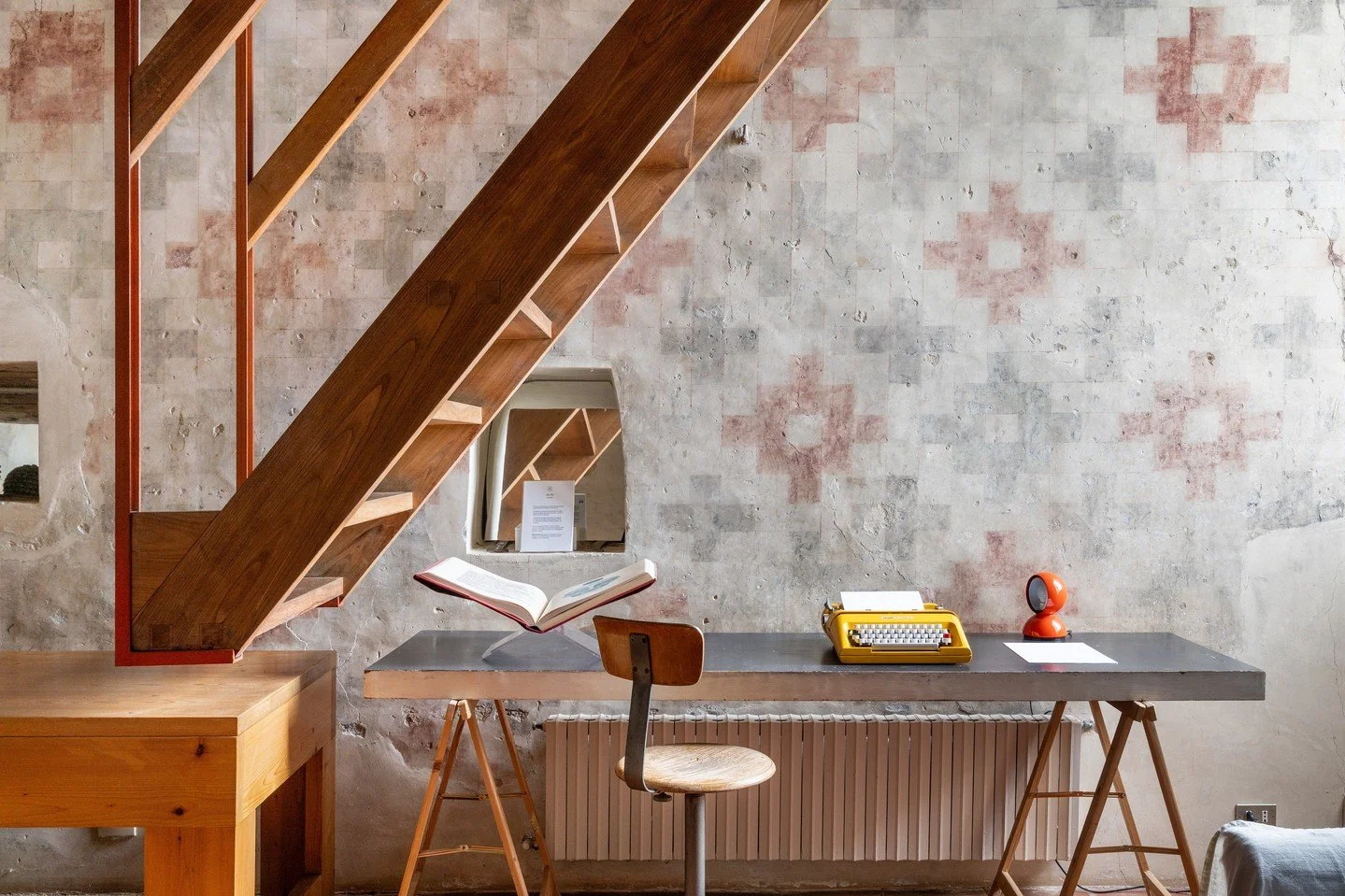 A room made for curiosity and quiet inspiration.⁠
⁠
In Torre di Sopra&rsquo;s library, design and imagination meet, with the iconic Eclisse lamp standing proudly among shelves of books and creative treasures.⁠
One of our favorites: The Red Book by C.