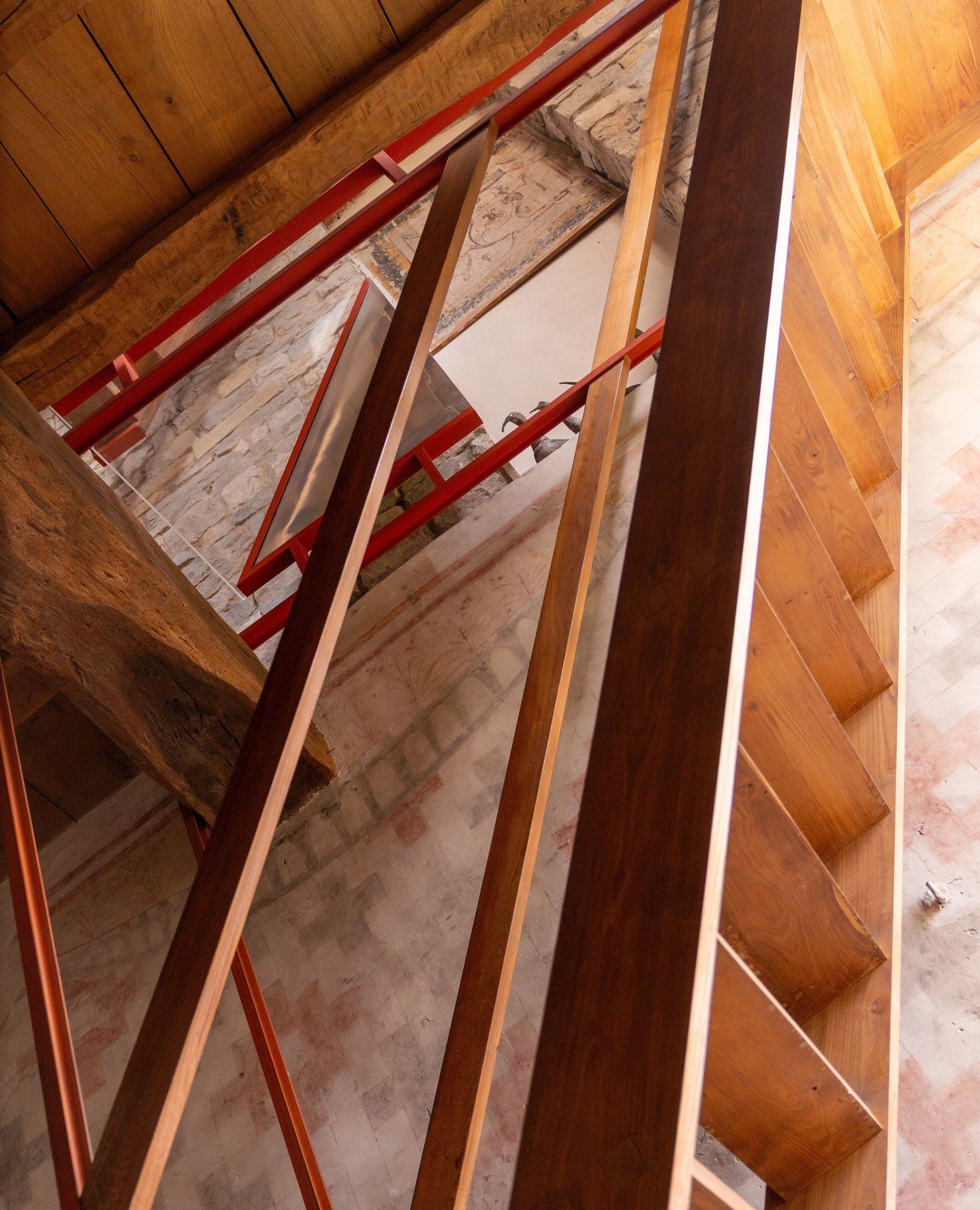 Between stories and spaces. ⁠
⁠
The wooden stairs rising from the library to the Artist Suite carry you upward through texture and time. Warm wood beneath your feet, centuries-old frescoes quietly lining the walls.⁠
⁠
A simple passage but rich with a