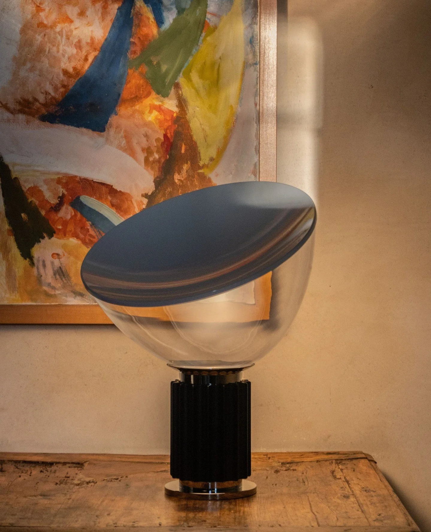 Some lamps illuminate a room, others shape it.⁠
⁠
The Taccia by Flos, designed by Achille and Pier Giacomo Castiglioni, is one of those rare objects where engineering becomes poetry. ⁠
Its iconic reflector softly redirects the light upward, creating 