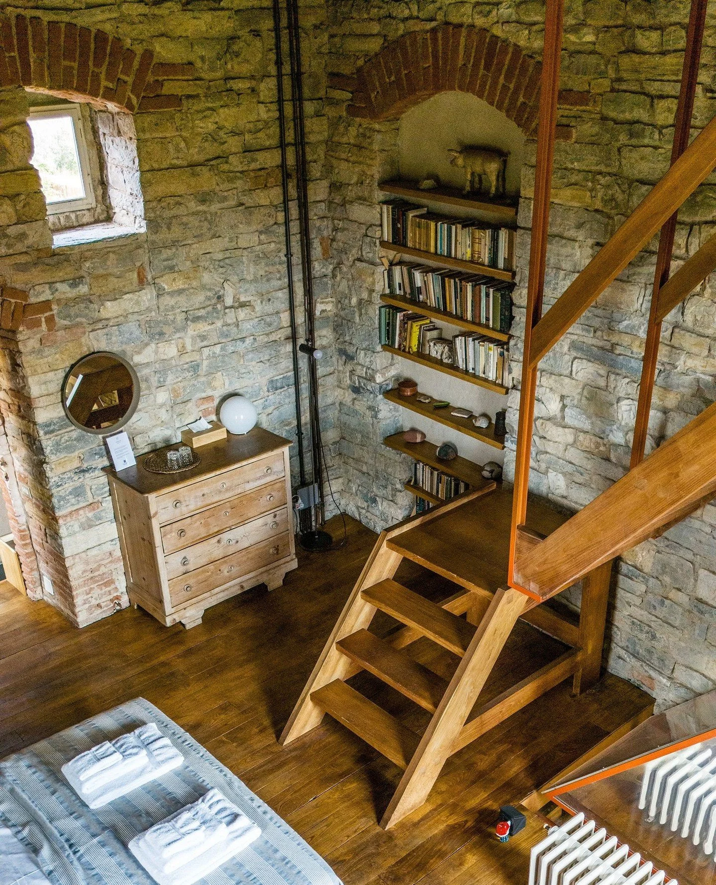 Your place, above it all.⁠
⁠
The Artist Suite is defined by quiet design. Clean lines, a thoughtful bookcase, and wooden stairs that lead you gently upward through the tower.⁠
⁠
A space that feels minimal, yet complete: made for slow mornings, long t