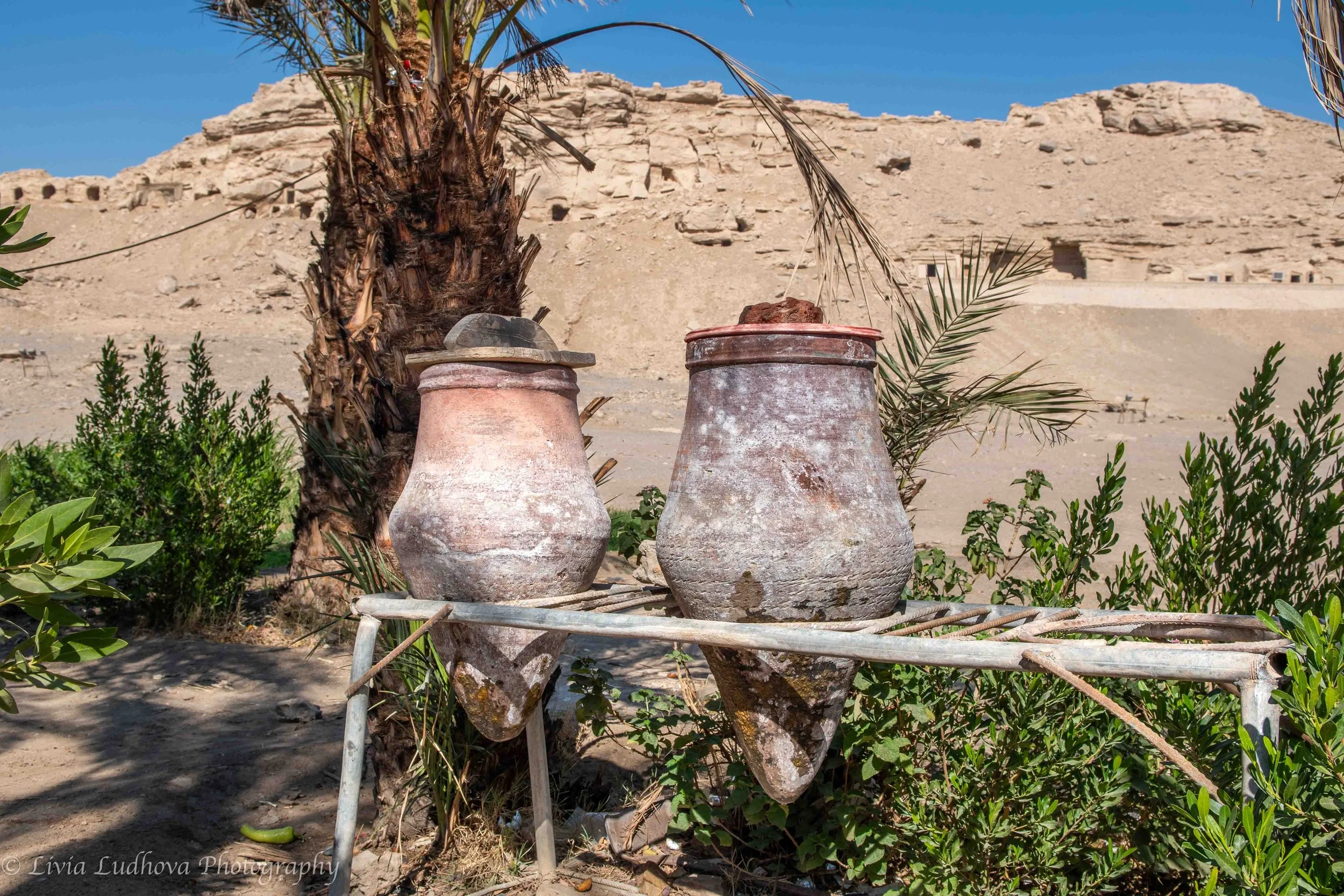 Water jars on a wooden stand - anyone passing by in need can get a drink.