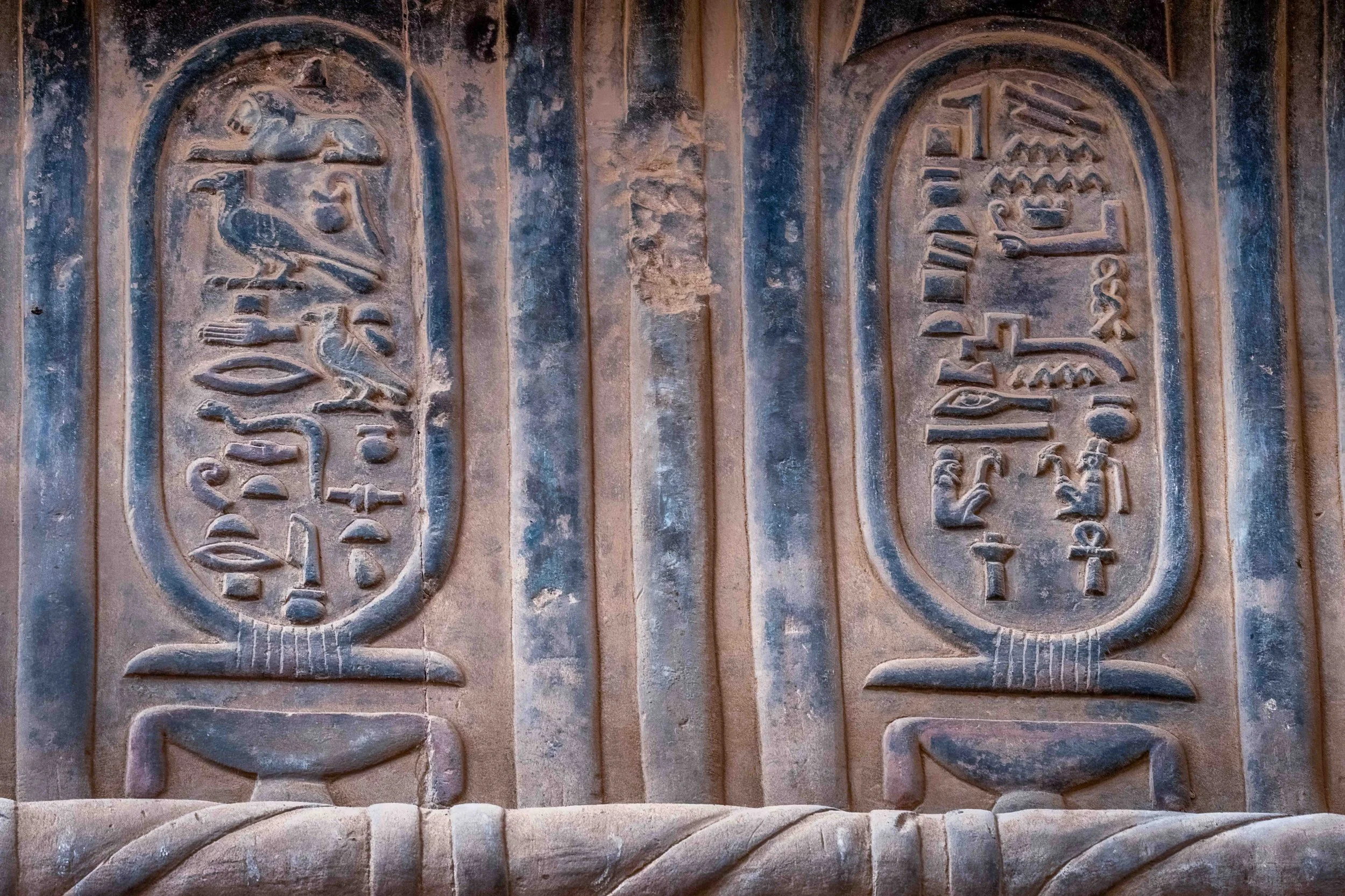Hieroglyphic cartouches — royal titulary carved in relief.