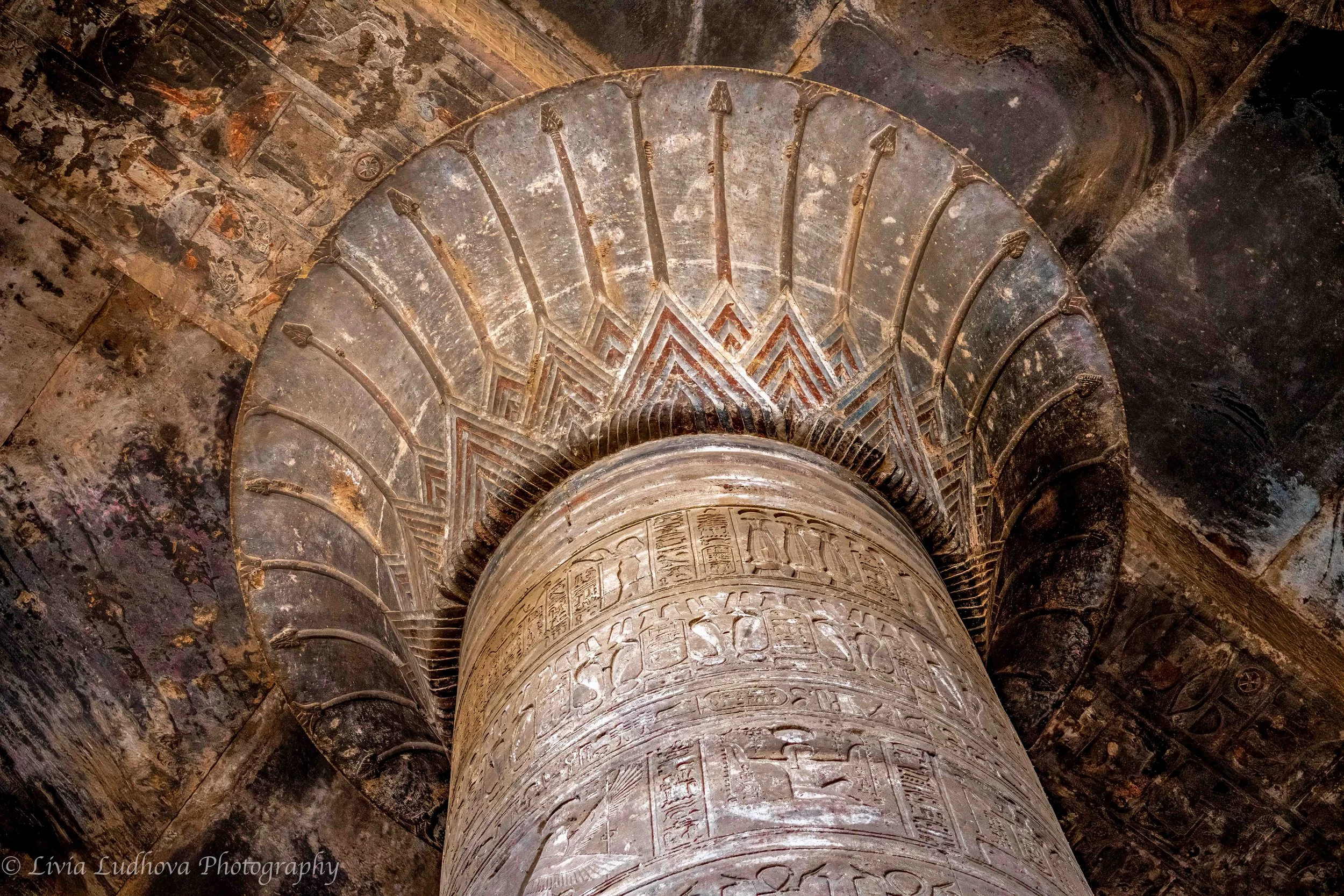 Lotus capital and column at Edfu, preserved beneath centuries of Nile silt and later revealed through careful excavation.