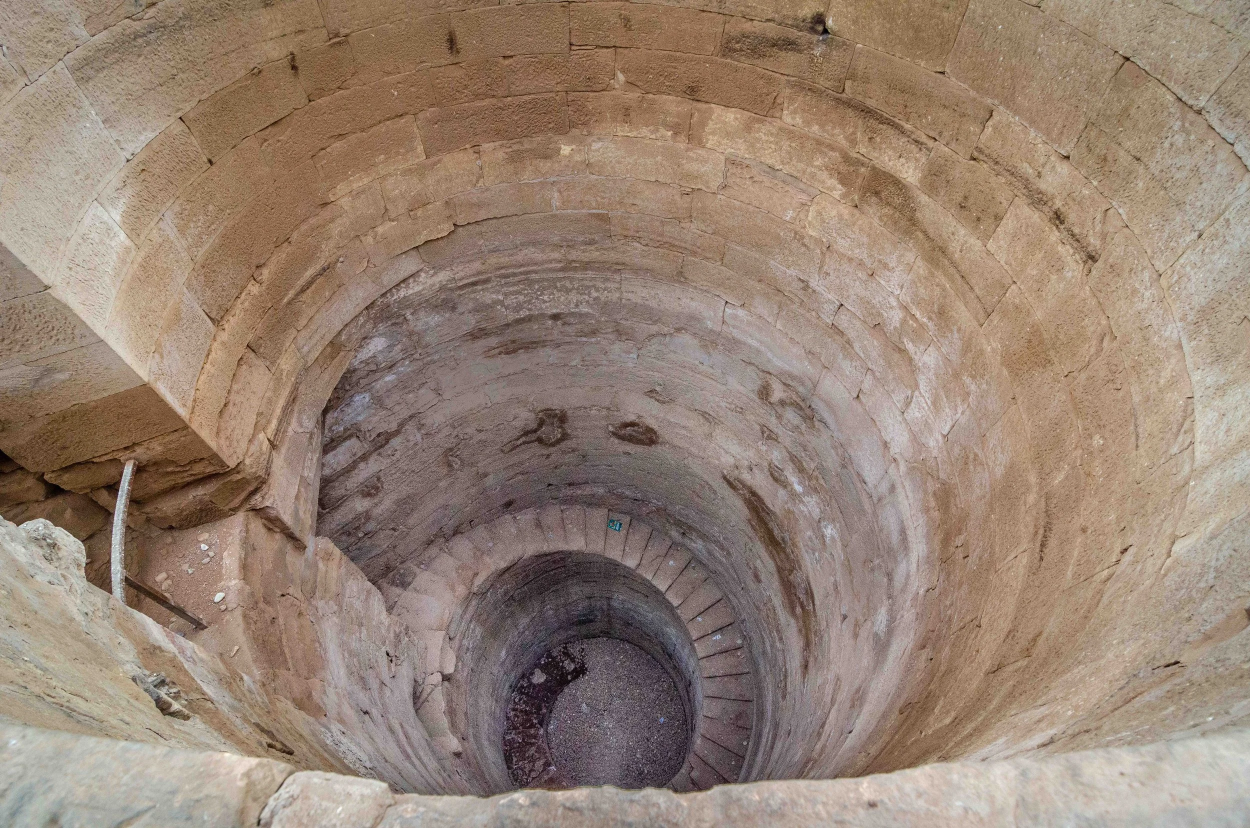 Spiral well shaft — Nilometer-related structure used to monitor Nile flood levels crucial for agriculture.