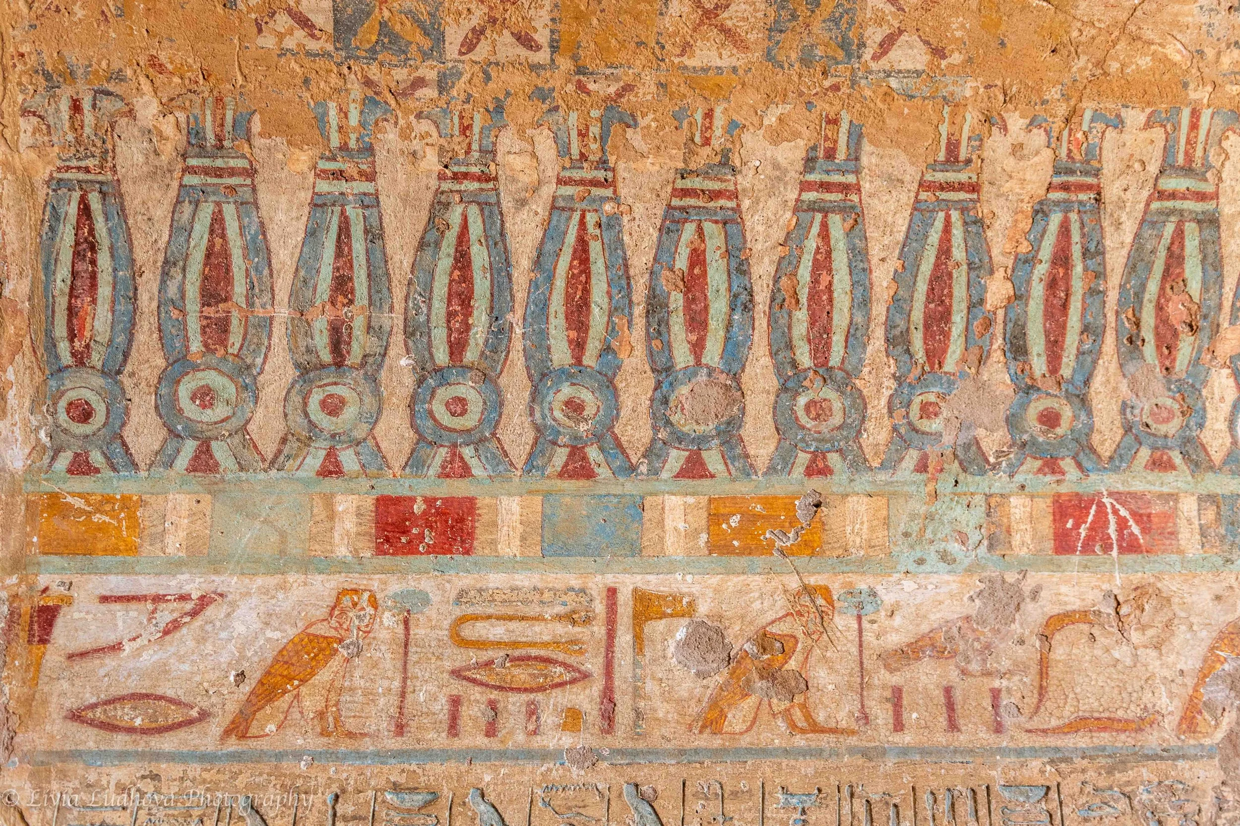 Decorative frieze with symbolic motifs.