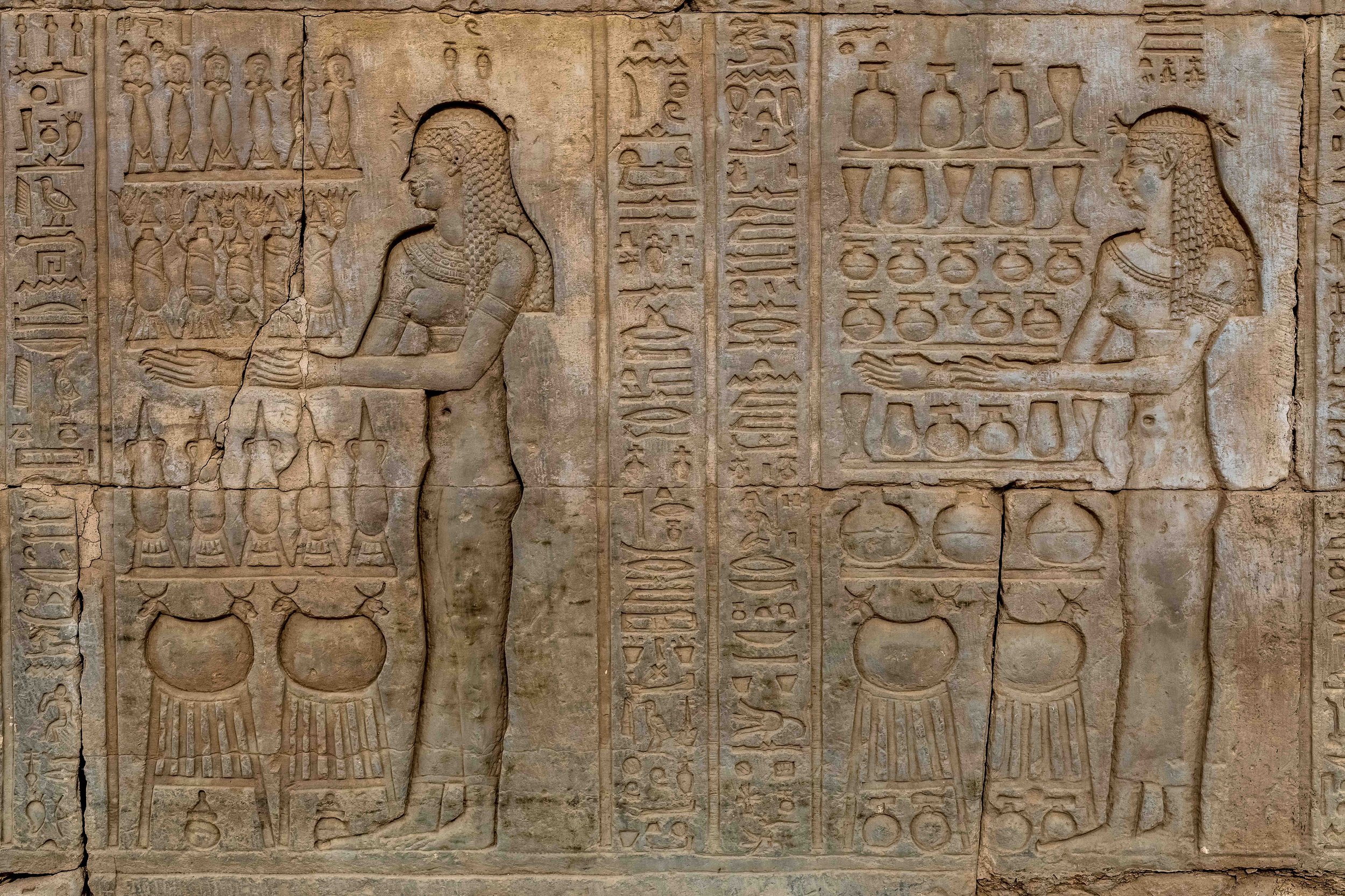 Carved wall with offering texts — ritual inscriptions at Kom Ombo.