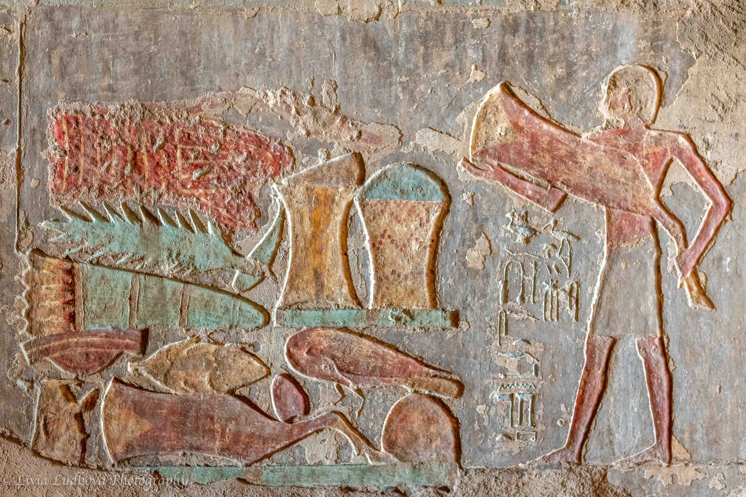 Offering and ritual action scene, note clearly recognazible food items.