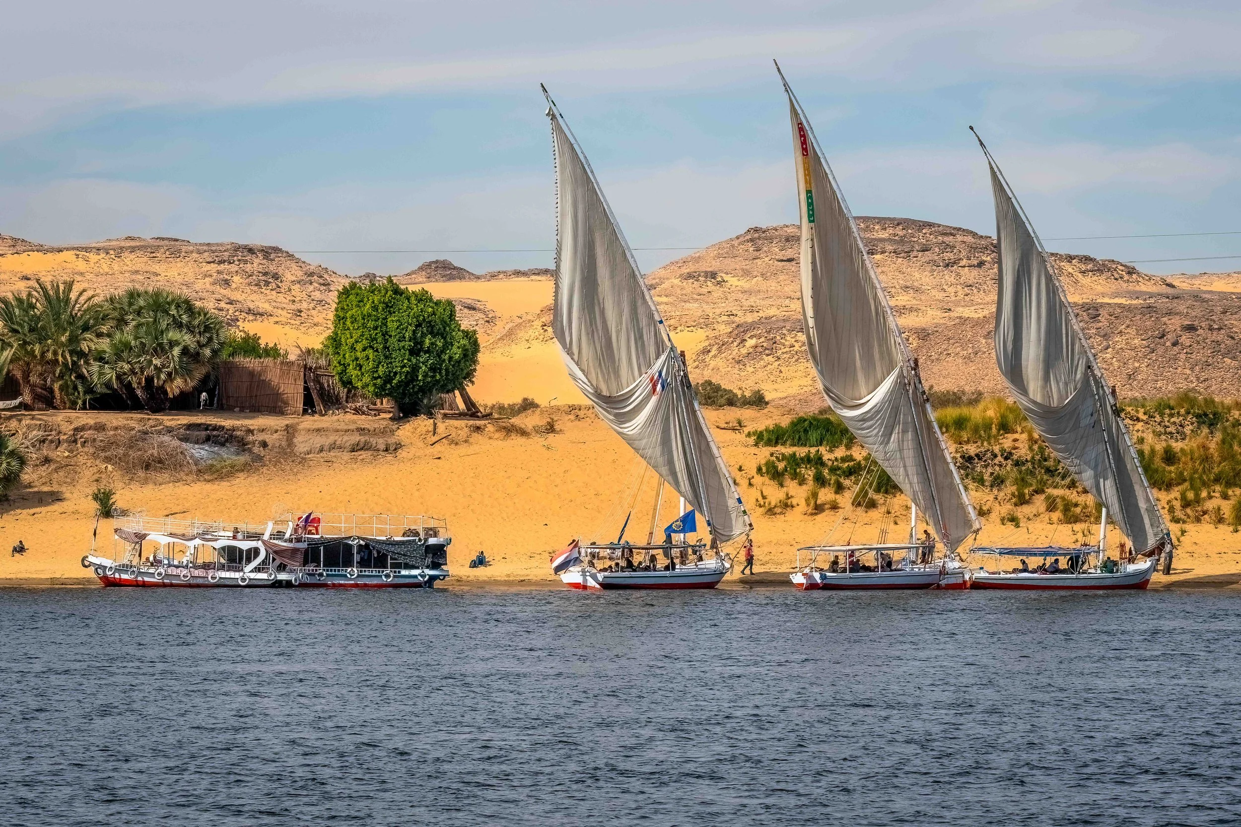 What a fantastic Nile scene with boats, golden sand, and blue water.