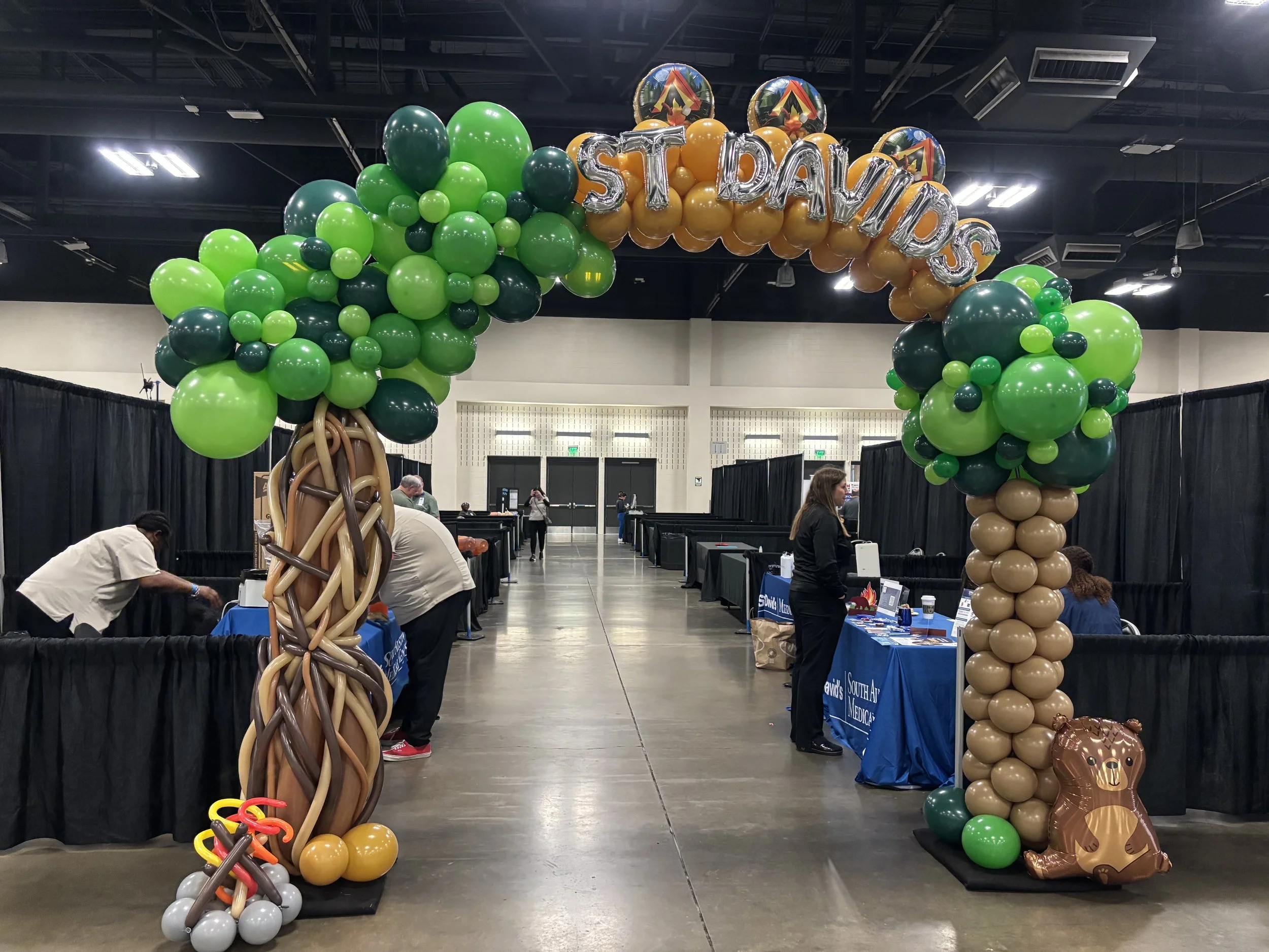 camping theme balloon arch