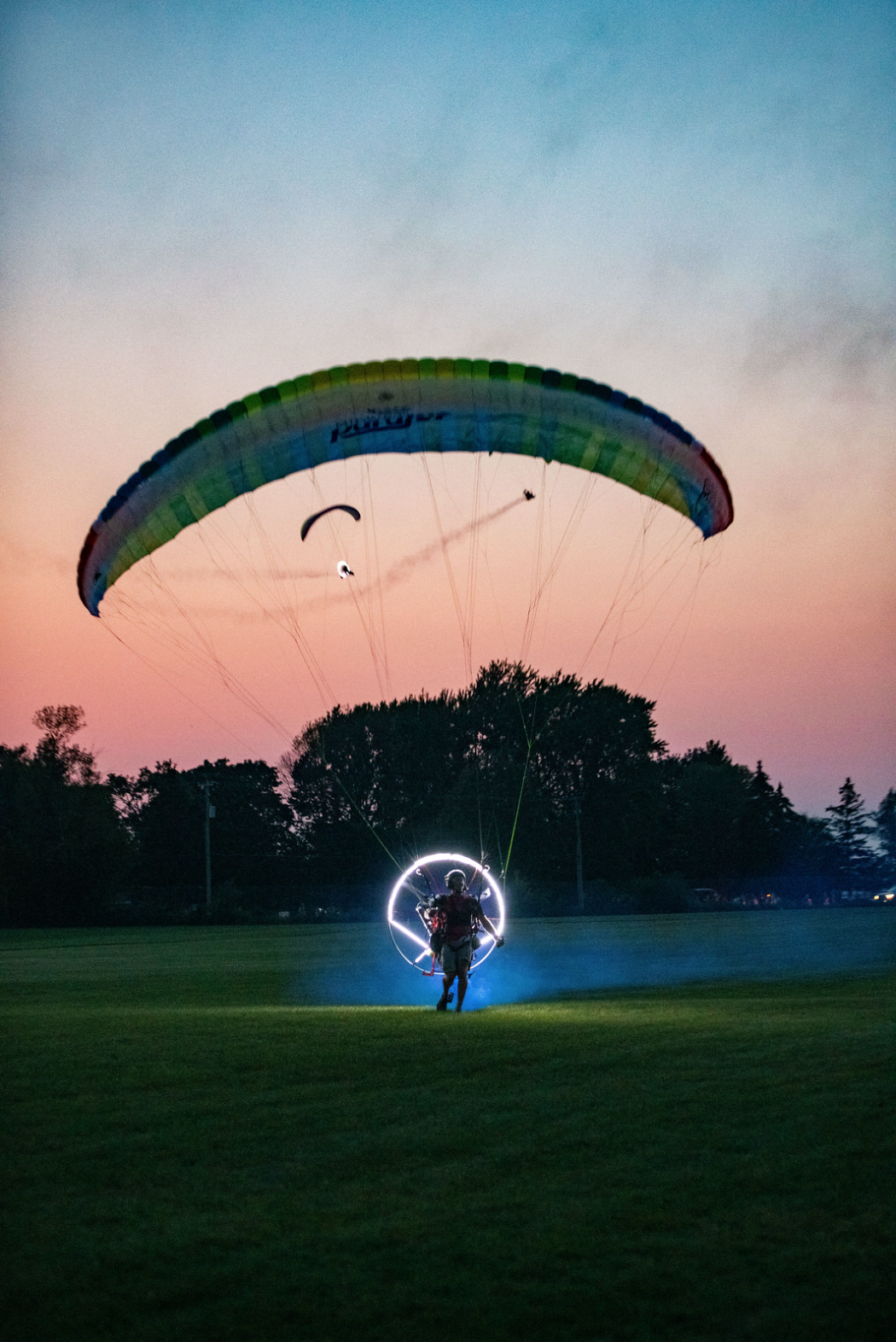 Steve Reed of Midwest Parajet after landing during the Twilight Flight Fest at AirVenture 2021