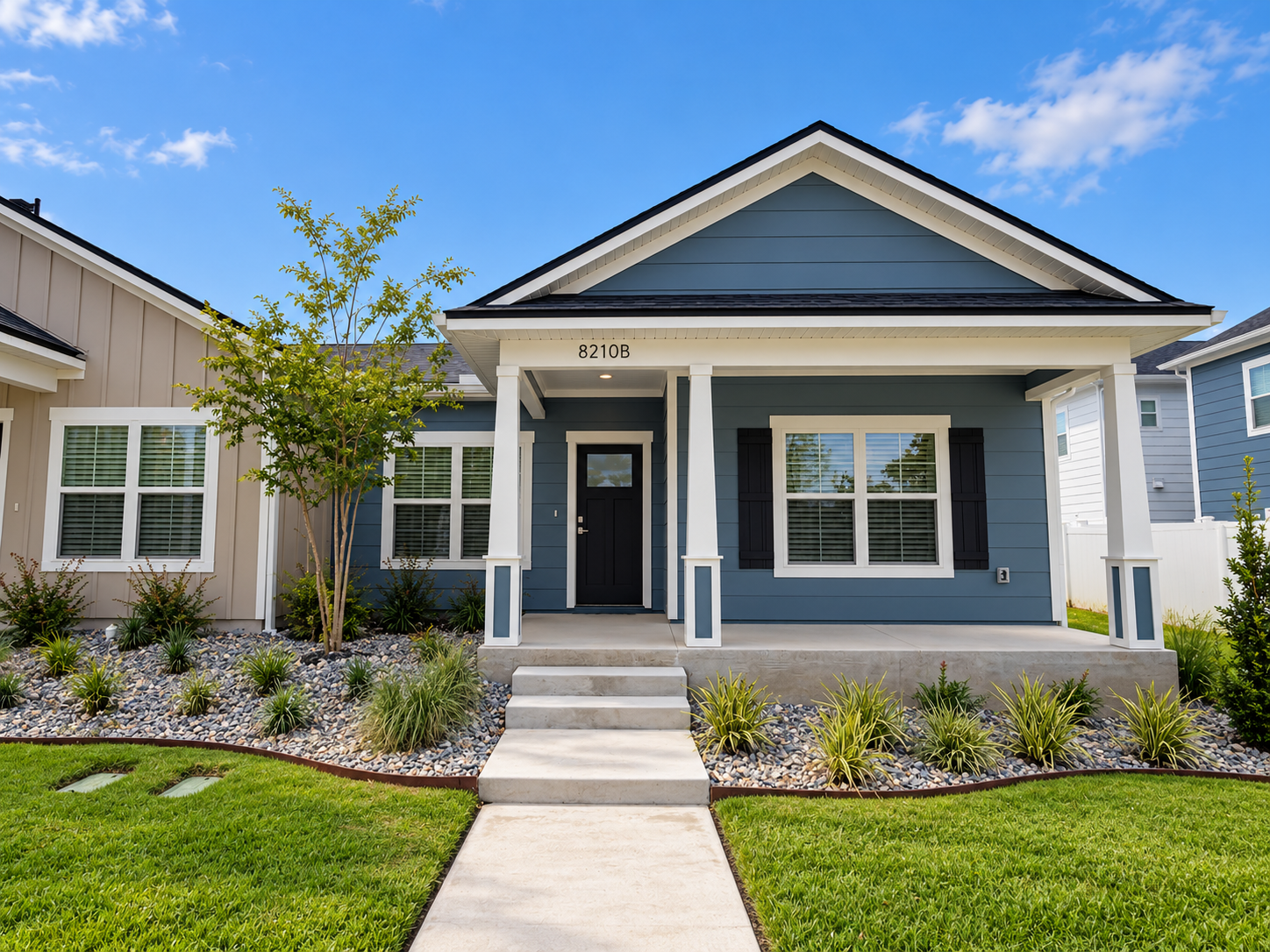 Right-side exterior of a three-bedroom, two-bathroom duplex home at Cottages on the Avenue, a pet-friendly rental community in Gainesville, FL.