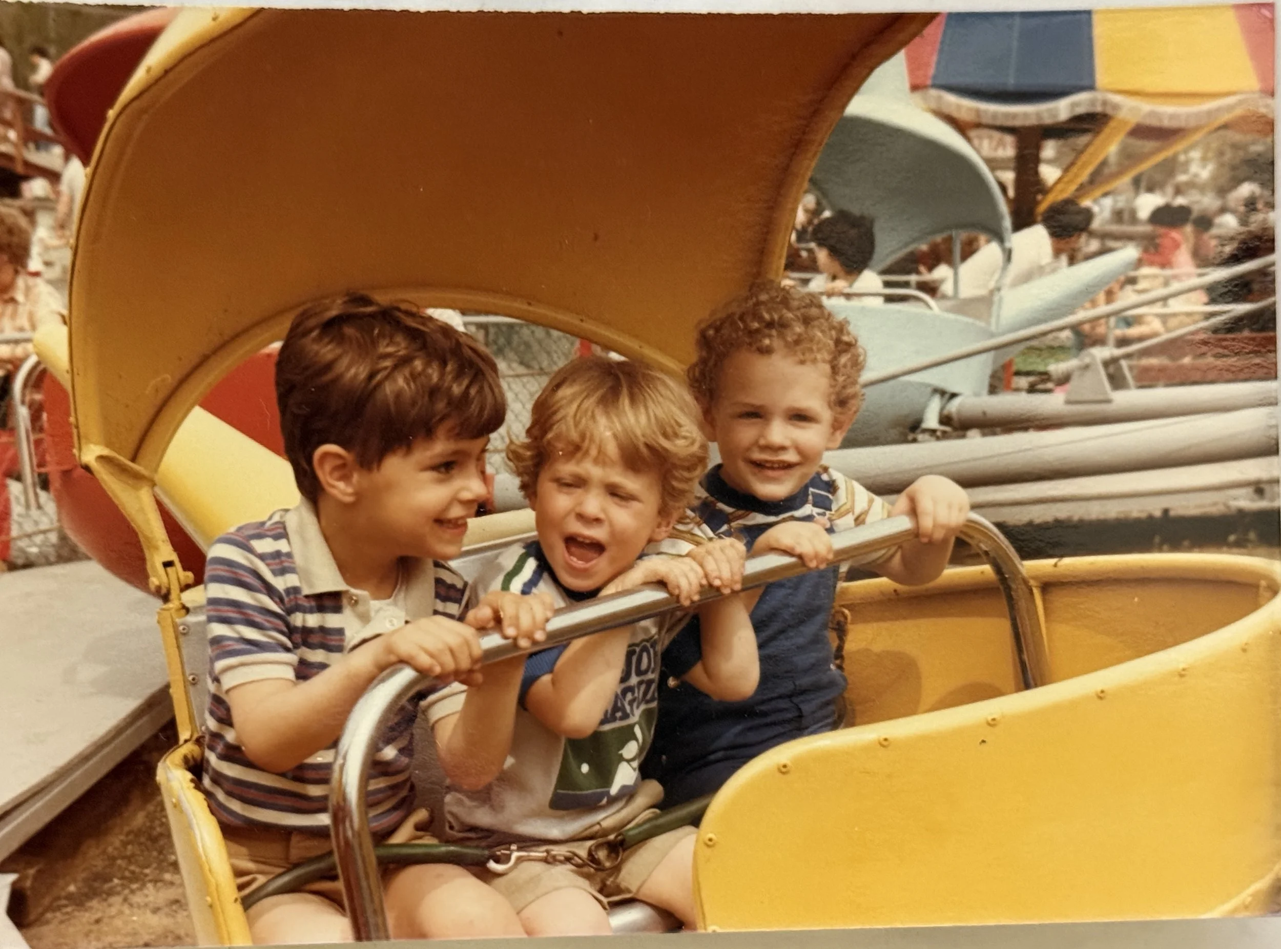 3 young boys enoyng a ride on one of Bowcraft's rides