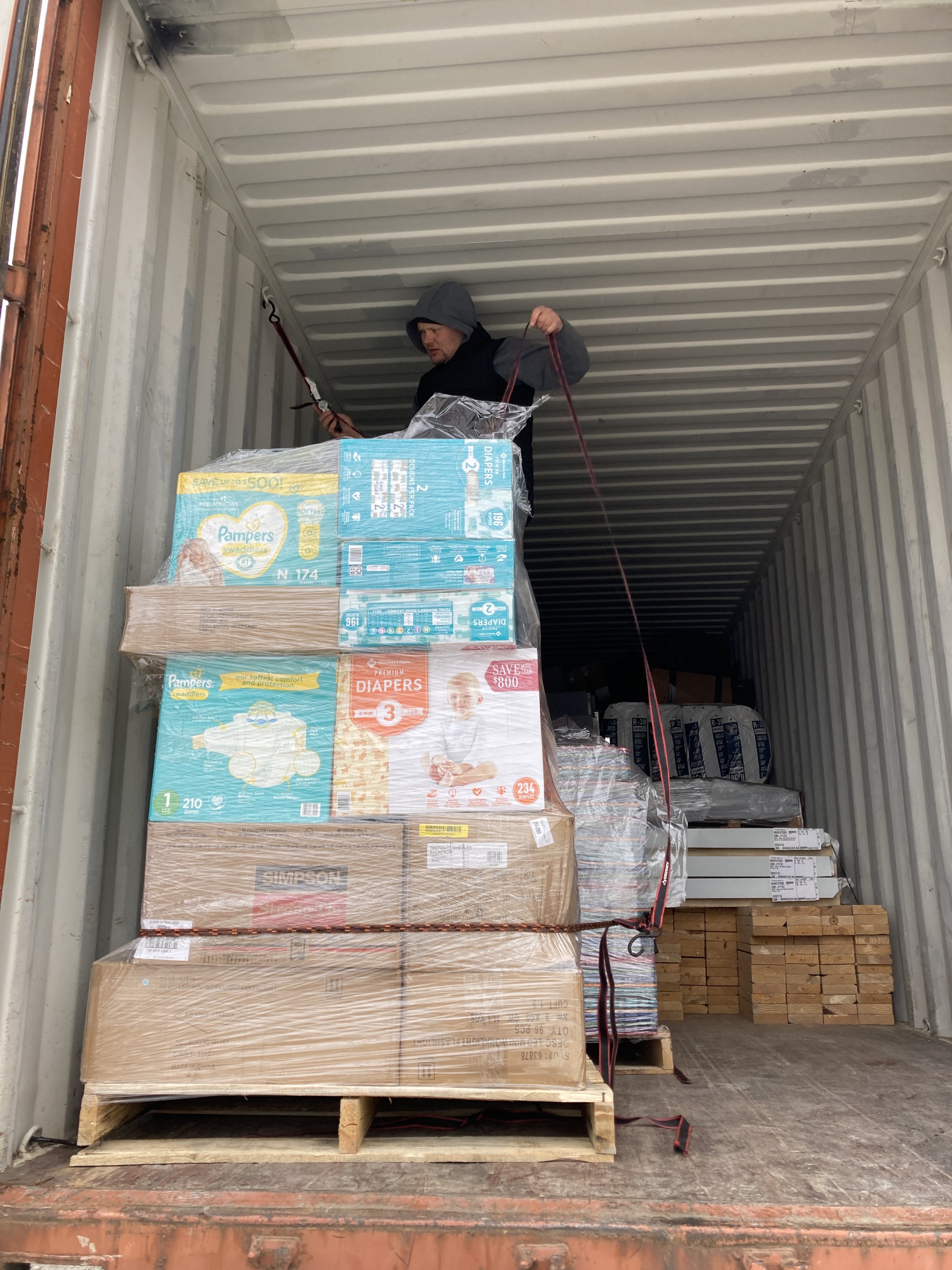 International Networx board member, Pavel Kakurin, securing the humanitarian cargo.