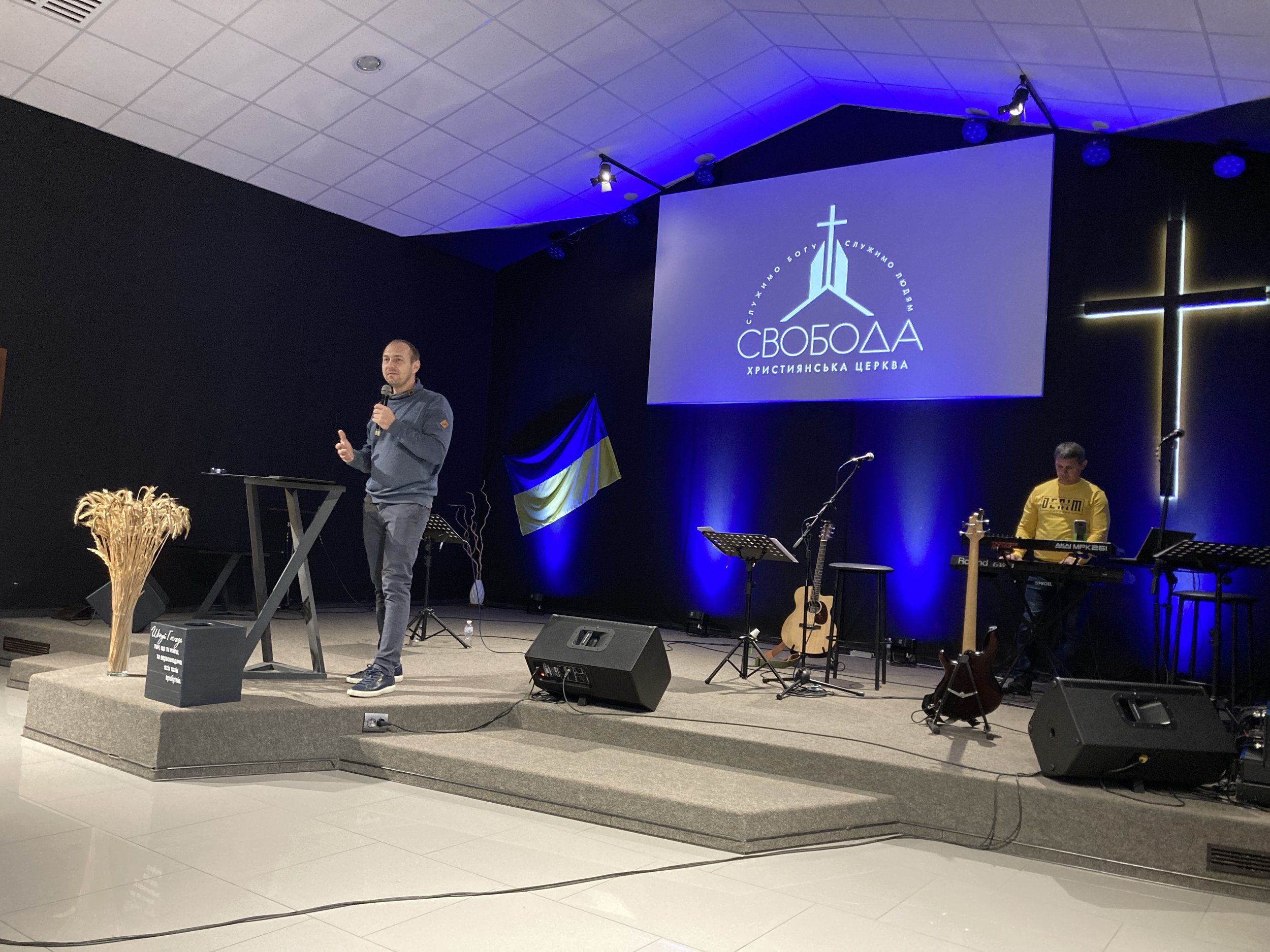 Pastor Dima Golub ministering in a Sunday service