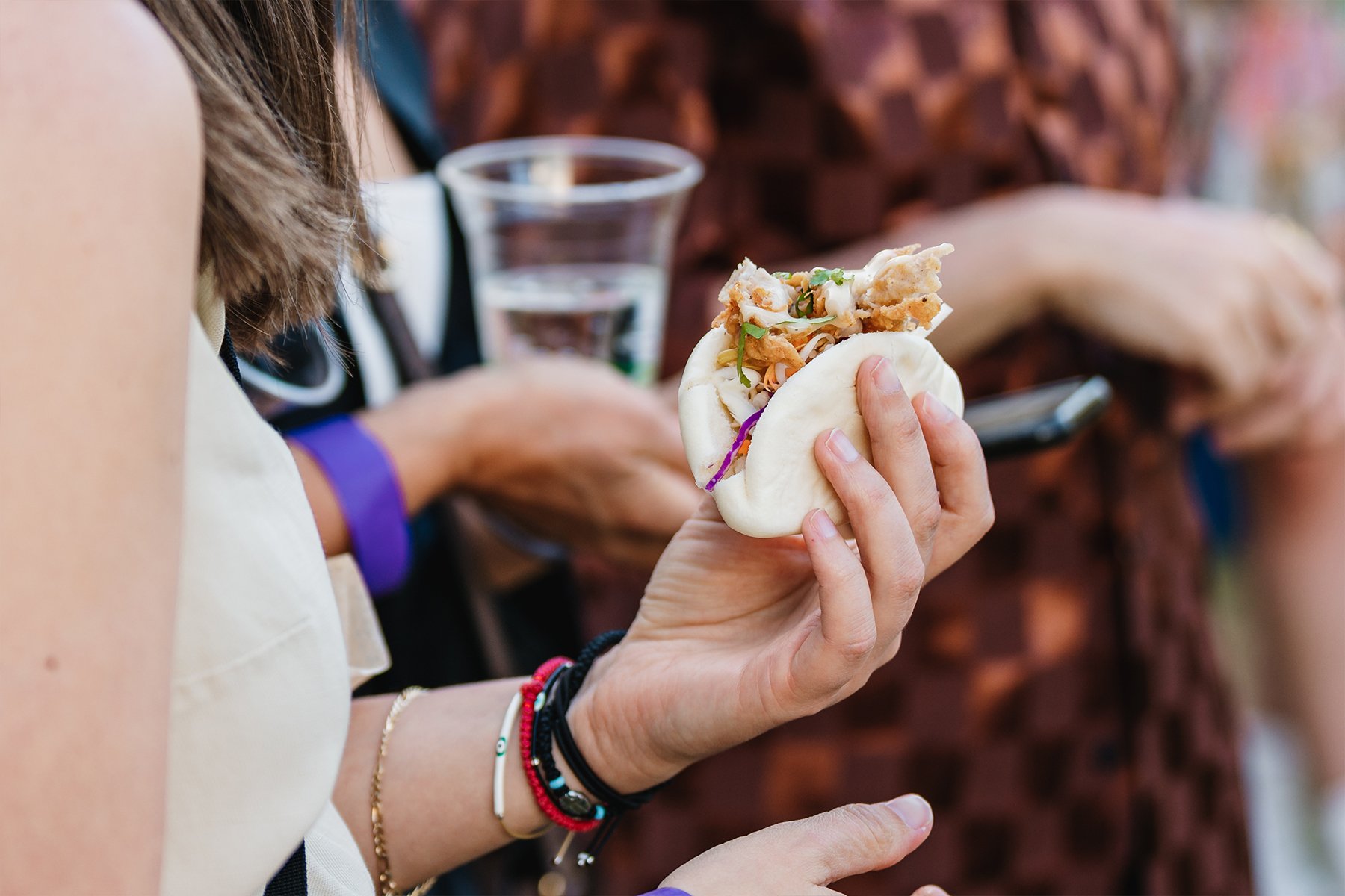 person holding bao bun at Fools Paradise Adelaide Fringe