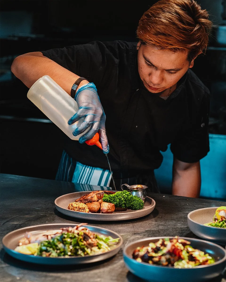 chef preparing steak and vegetables