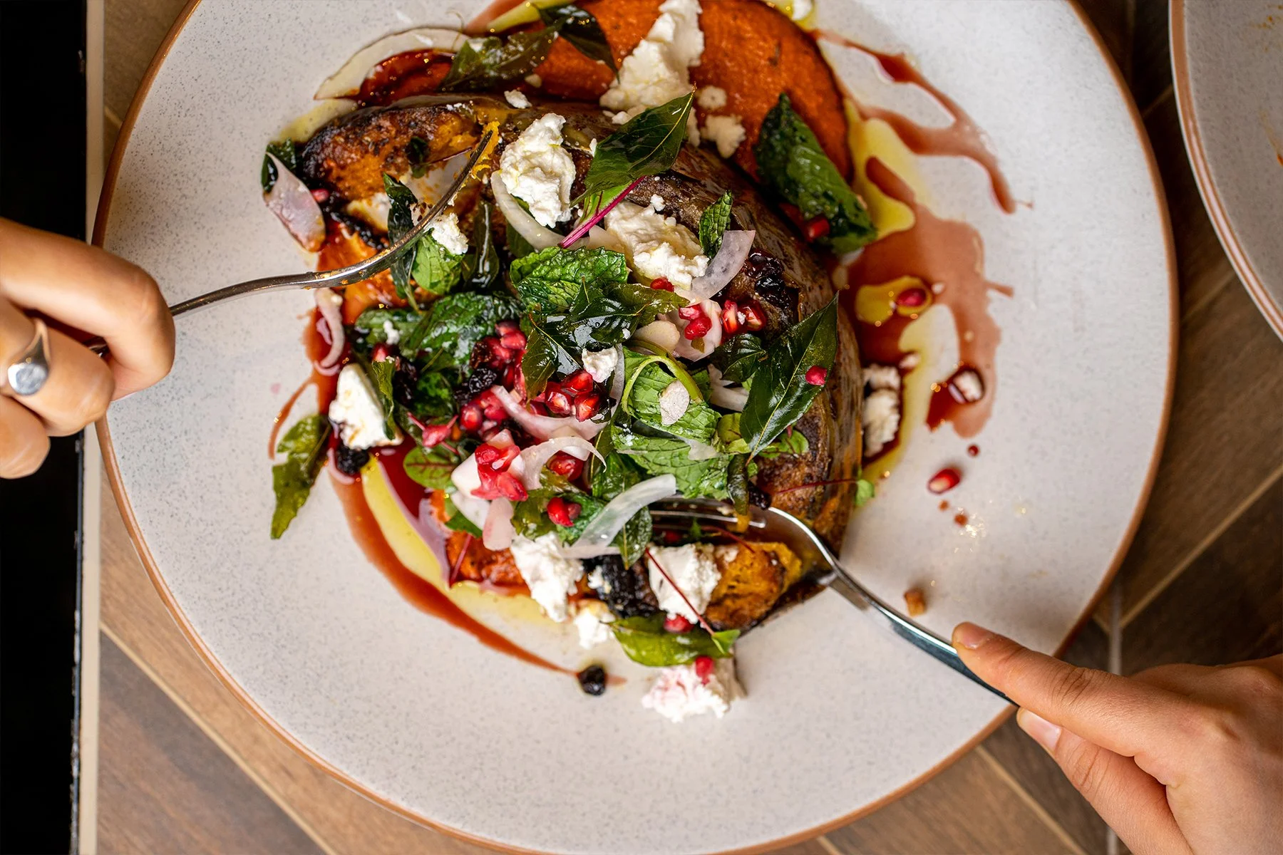 2 people sharing a pumpkin salad flatlay