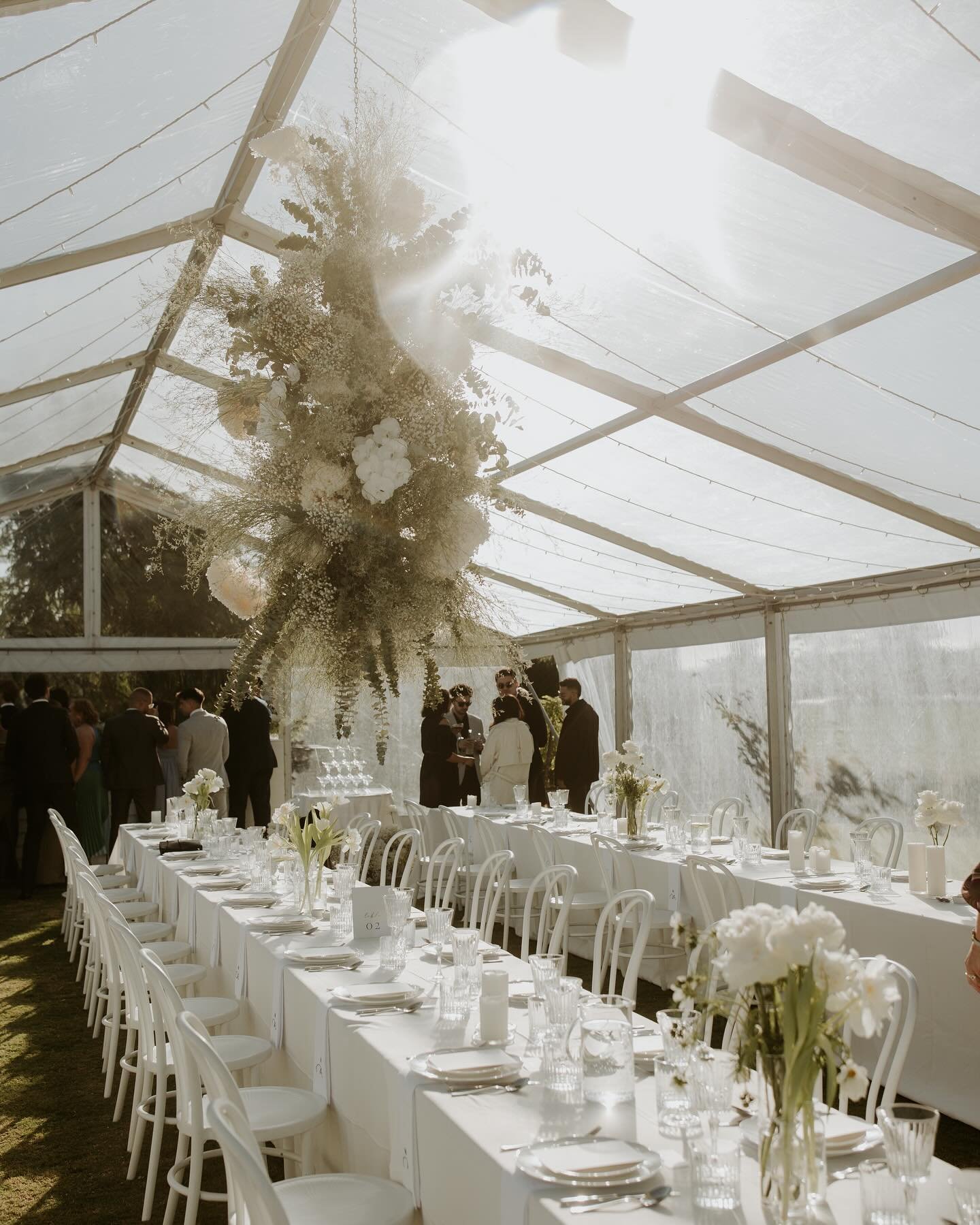 We transformed Mikaela and Nick's mood board and styling vision into reality with a distinctive roof installation, providing a magical space for their reception. Crafting a detailed floral brief is key; we maintained clear communication with our flor