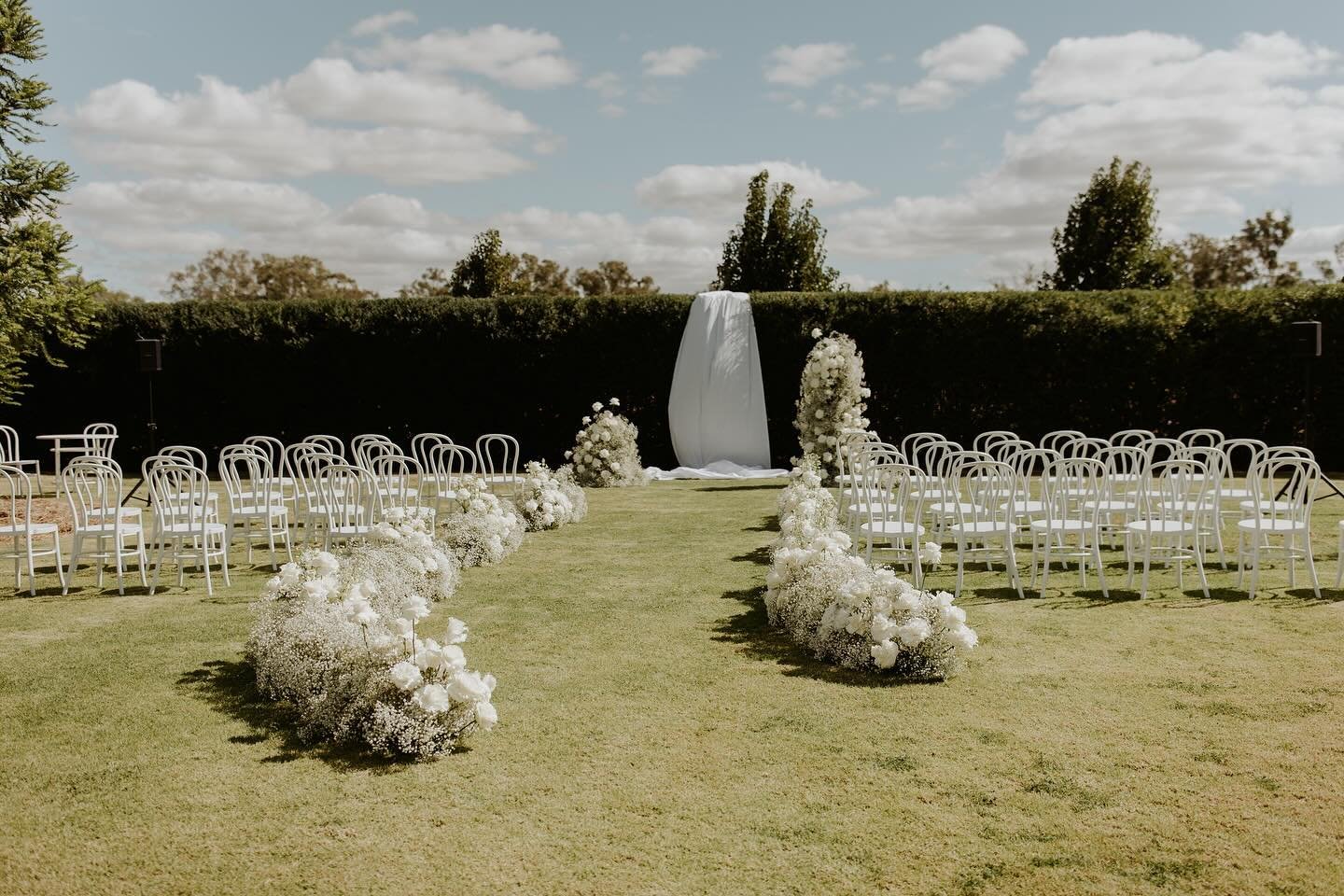 Transforming Mikaela and Nick&rsquo;s dream into reality on a whimsical Autumn day. A chic garden ceremony unfolded with a string quartet, delicate florals lining the aisle, and an ethereal backdrop for Mikaela&rsquo;s radiant dress. White bentwood s