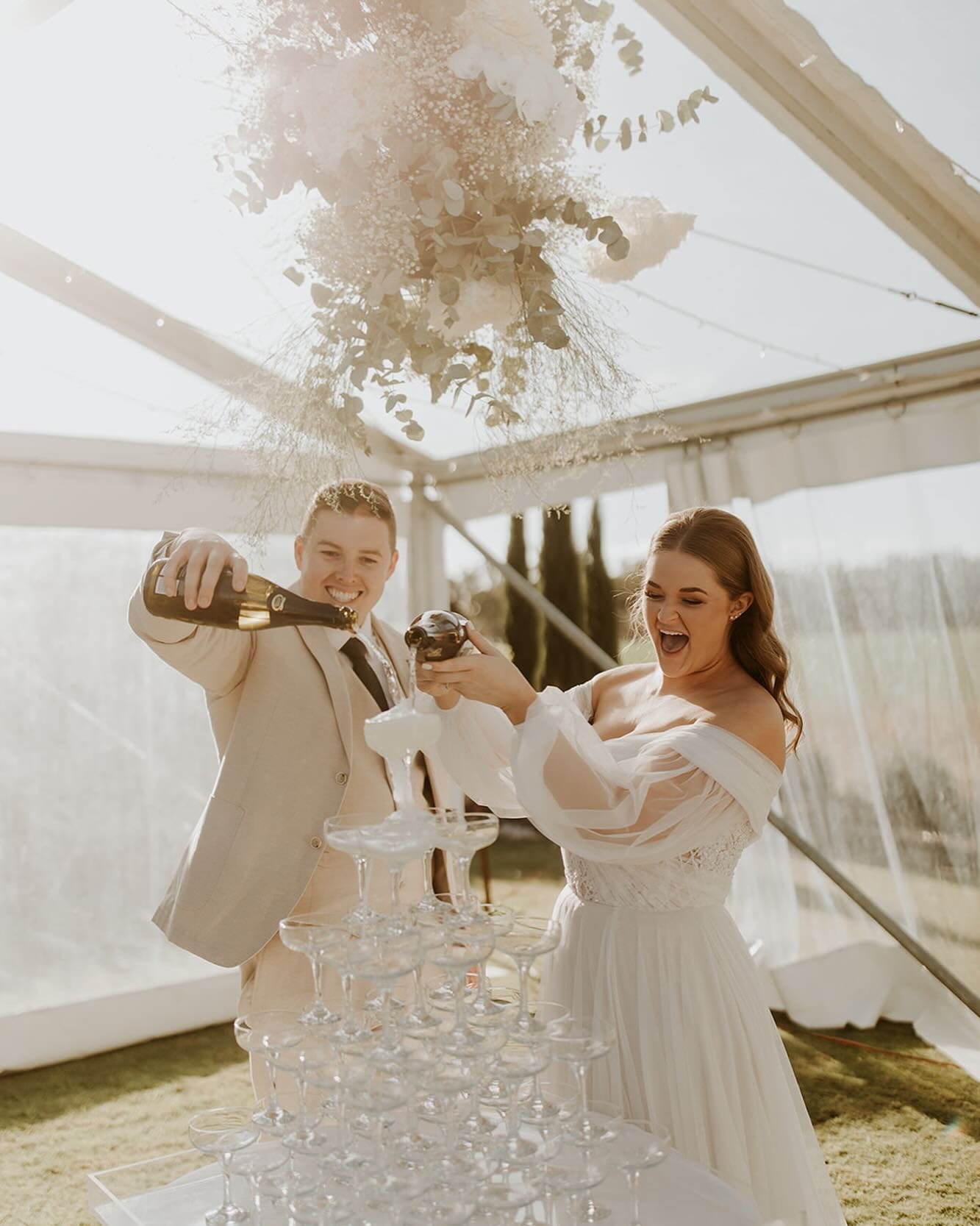 Mikaela and Nick&rsquo;s garden wedding: where dreams met reality. Our end-to-end event planning, styling, and design added a touch of romance, refinement and sophistication. Delicate whites amidst lush greenery, creating unforgettable moments. Ready