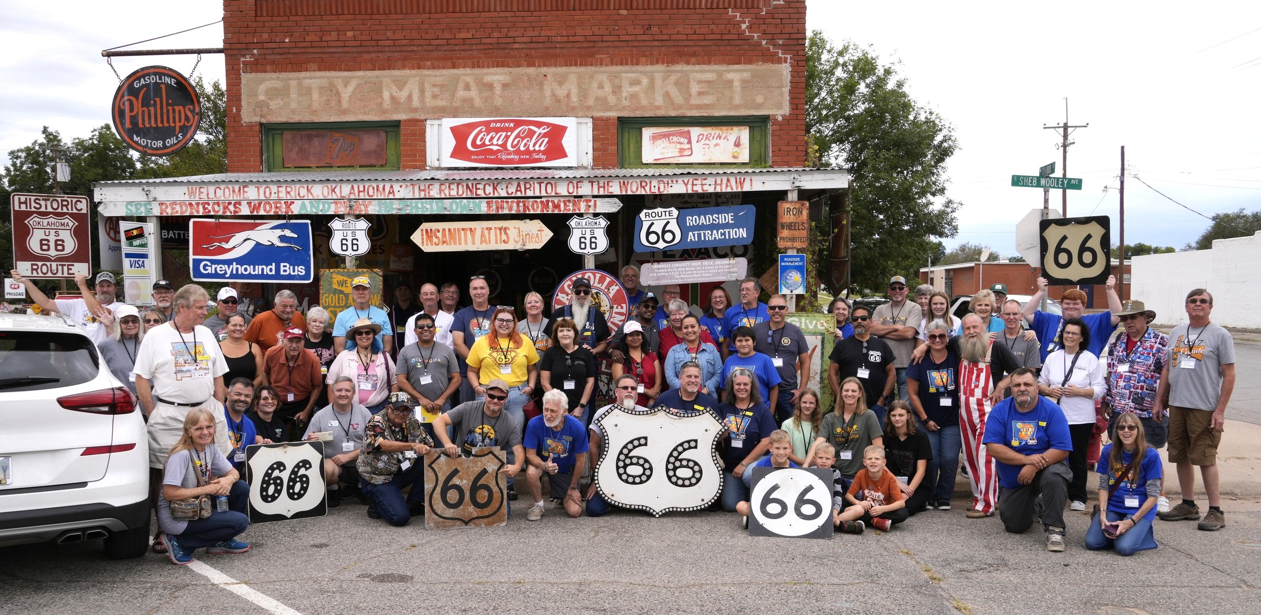  Group photo in front of the Sandhill Curiosity Shop, Erick, OK, Oct 6, 2023.  Harley Russell played guitar, sang, and entertained over 50 people.  Photo by Rich Dinkela. 