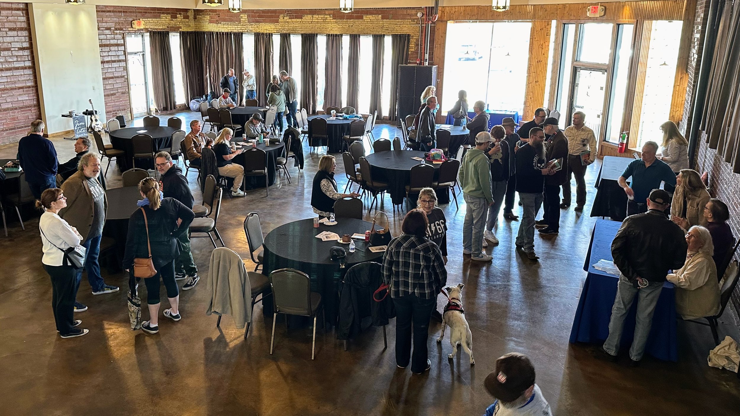 People visiting in the Renaissance Square Event Center, which was rented out for the day's festivities.