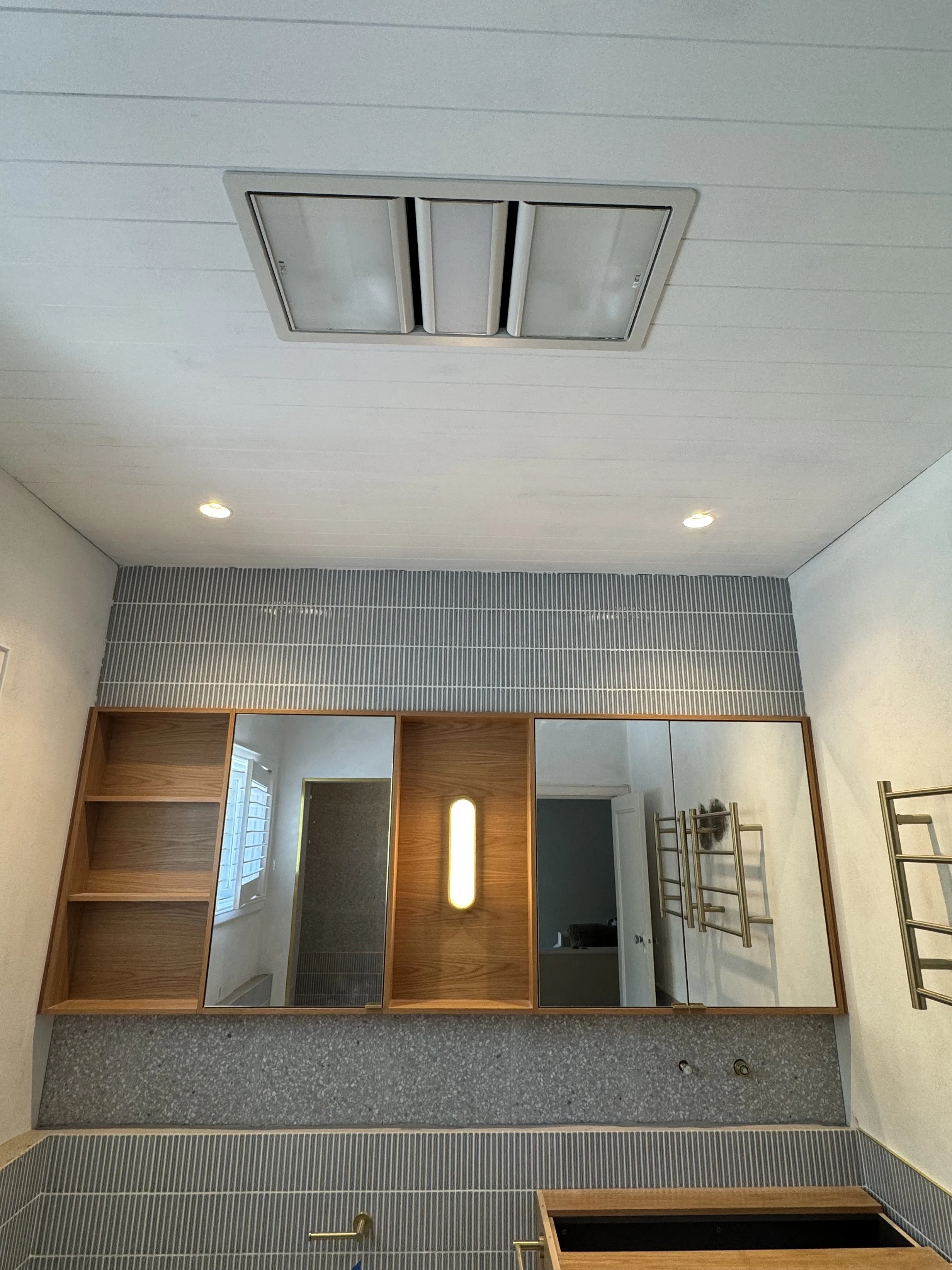 Bathroom renovation with new downlights, beauty lights, extraction fan, heated towel rack and temperature control