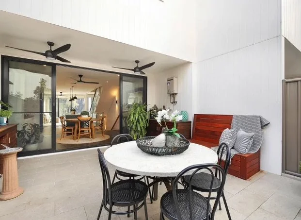 Outdoor renovation with ceiling fans and outdoor lighting