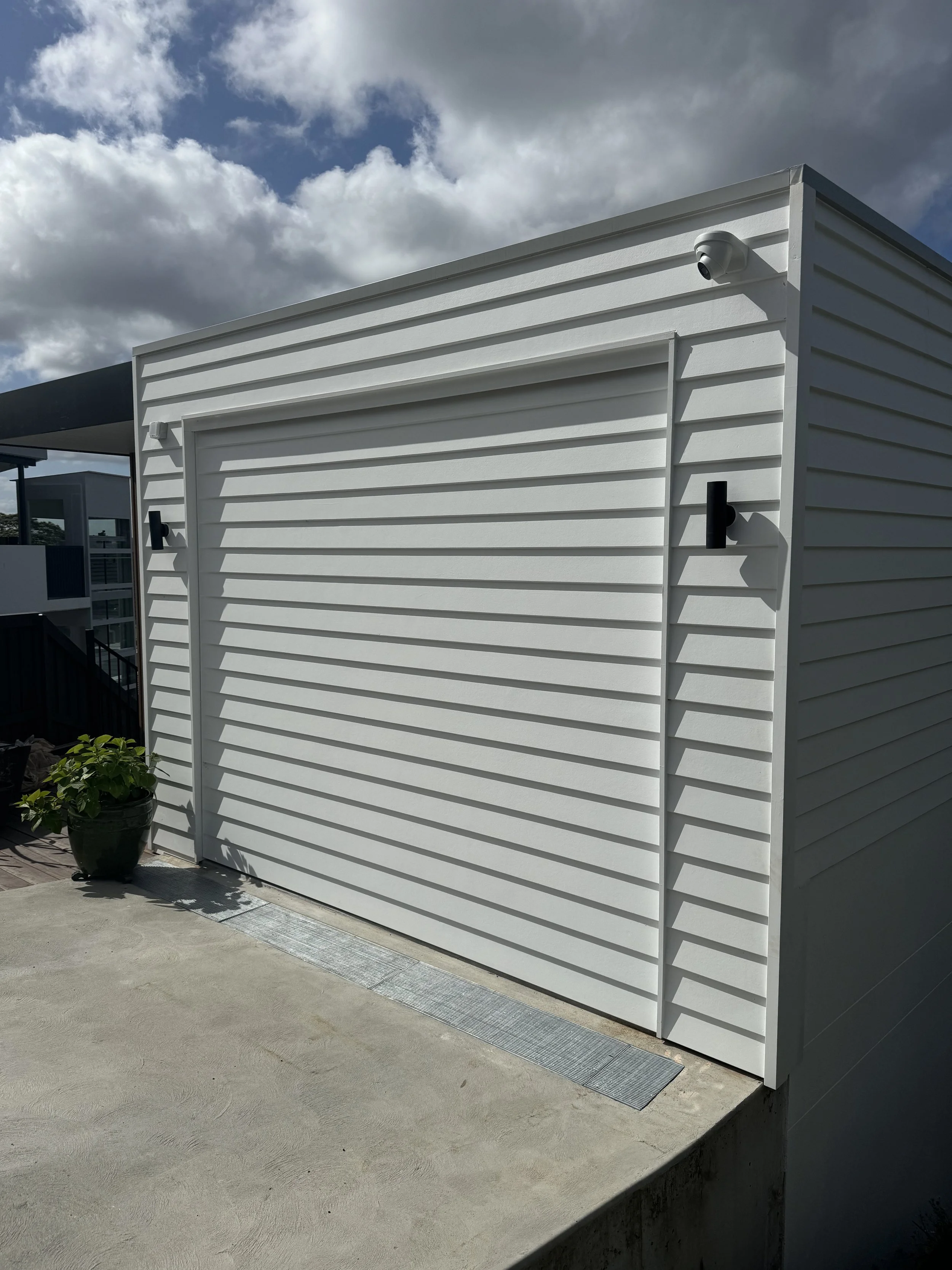 Exterior renovation with new lighting and security system.