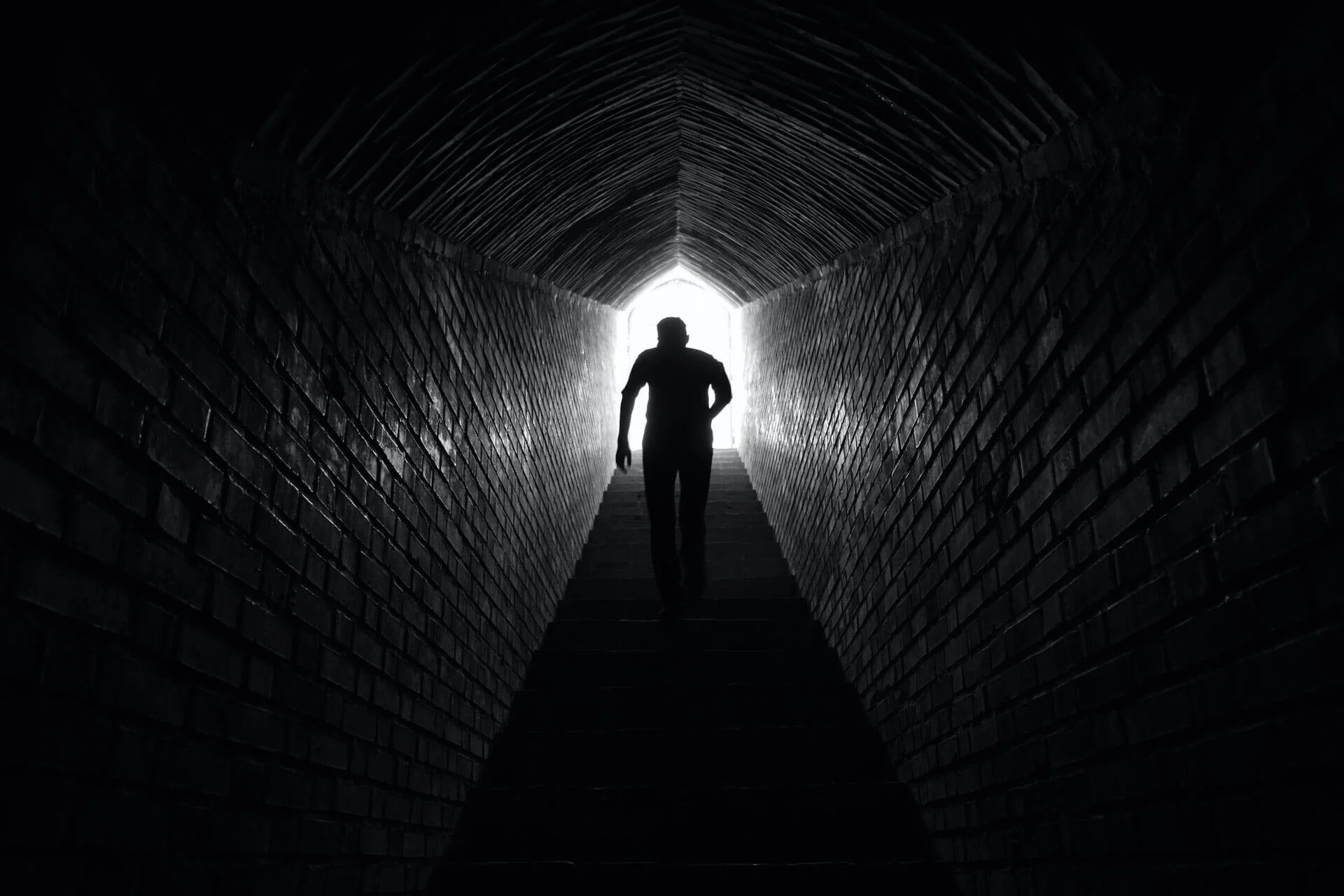 Image of a person climbing a set of stairs to success.