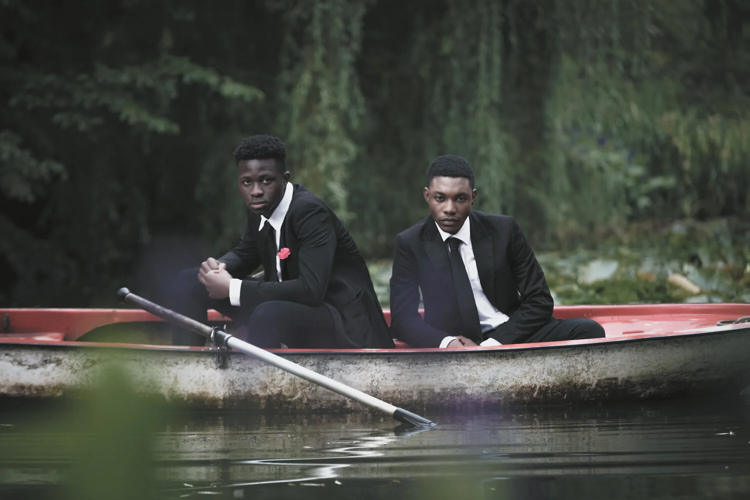 fashion-editorial-men-in-black-water-lily-pond-garden-8.jpg