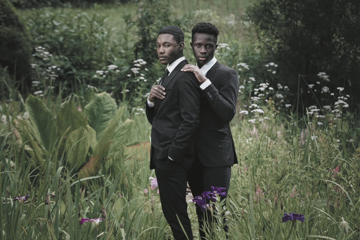 fashion-editorial-men-in-black-water-lily-pond-garden-1.jpg