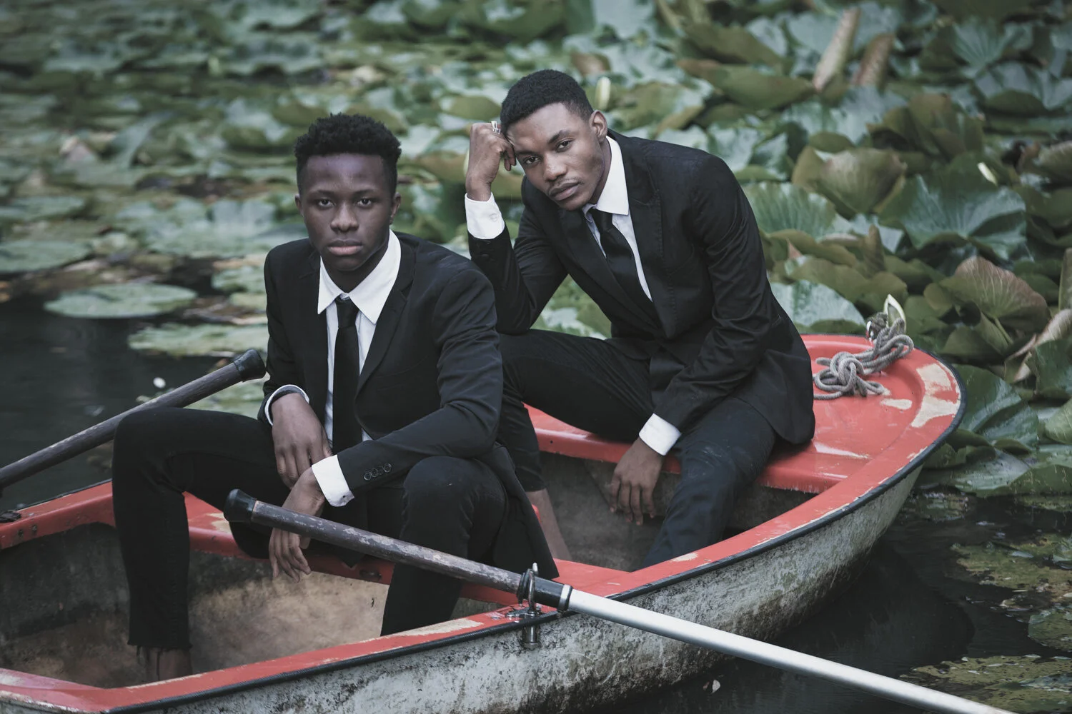 fashion-editorial-men-in-black-water-lily-pond-garden-5.jpg