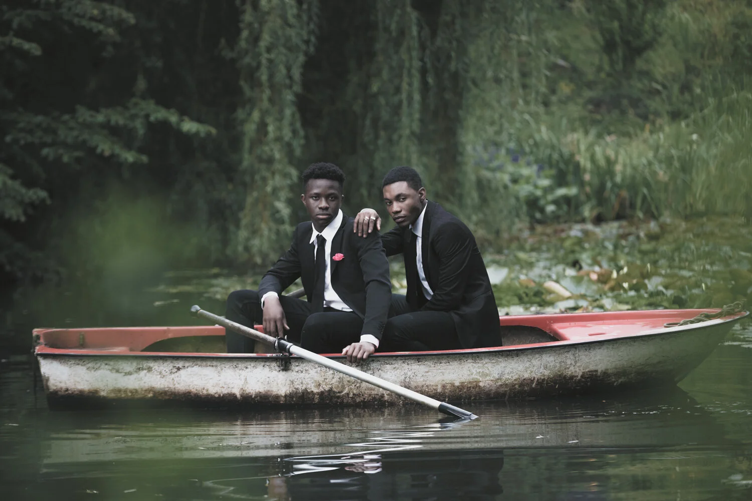 fashion-editorial-men-in-black-water-lily-pond-garden-7.jpg