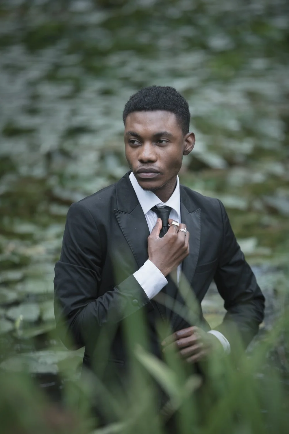 fashion-editorial-men-in-black-water-lily-pond-garden-15.jpg