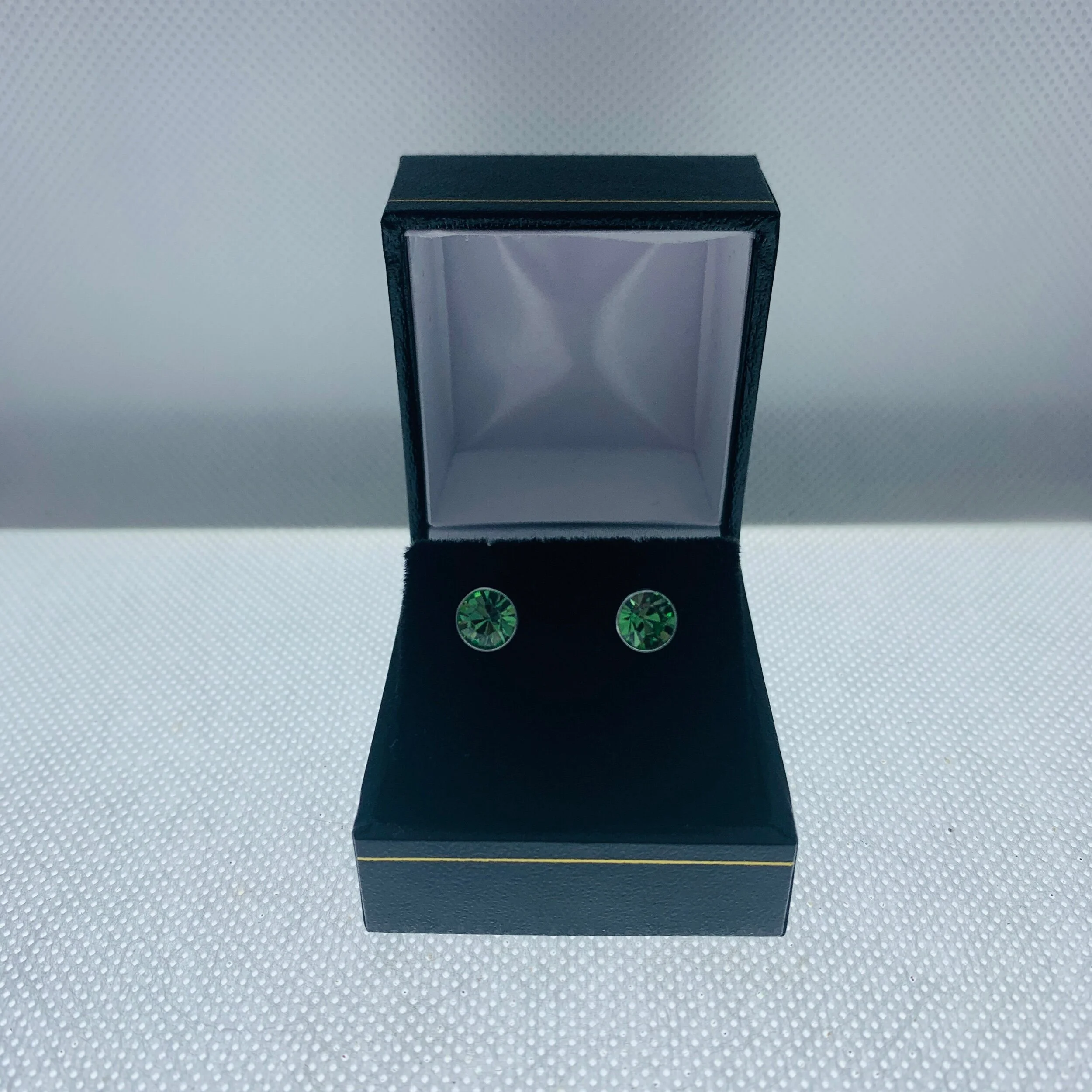 sparkling peridot green crystal round studs set in sterling silver