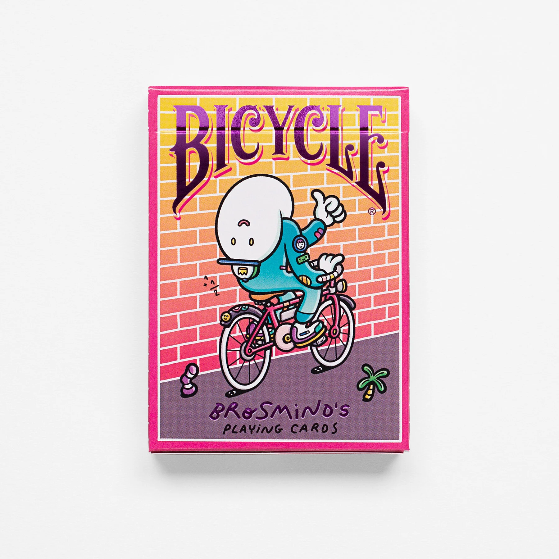 Top-down view of Bicycle Four Gangs card deck box, featuring a Brosmind character riding a bike with his head turned backwards.
