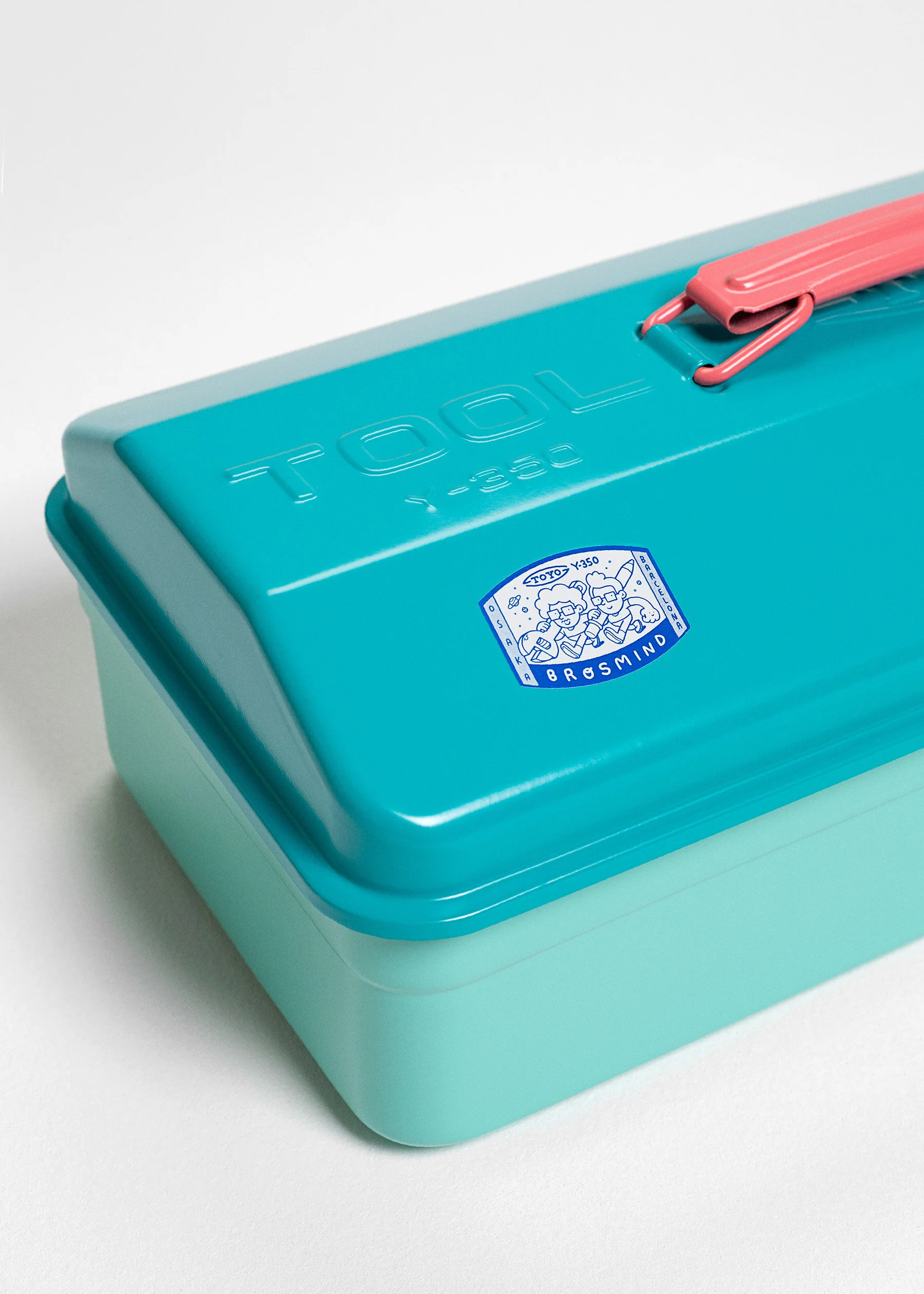 Close-up of the monochrome blue and white official Brosmind x TOYO seal sticker on the tool box metal.