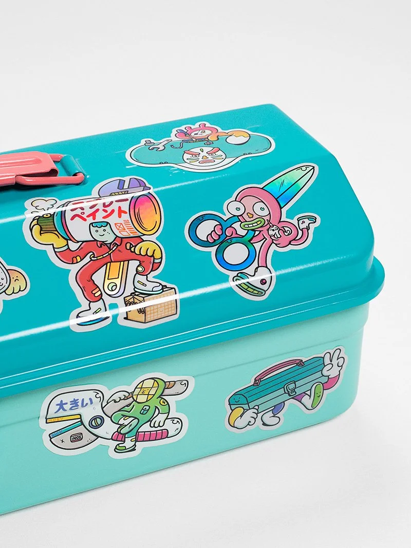 Close-up of the TOYO tool box customized with colorful DIY-themed Brosmind stickers included in the set.