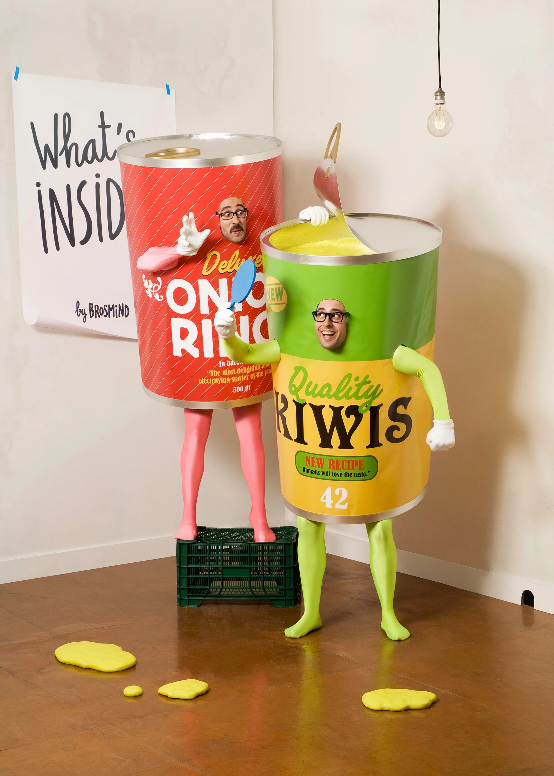 Brosmind brothers posing in giant food can costumes in a surreal portrait for the What's Inside? project.